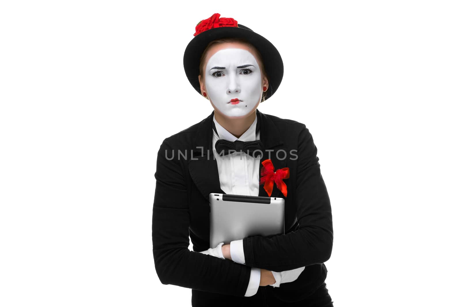 business woman in the image mime holding tablet PC and  intensely looking at the camera. isolated on white background
