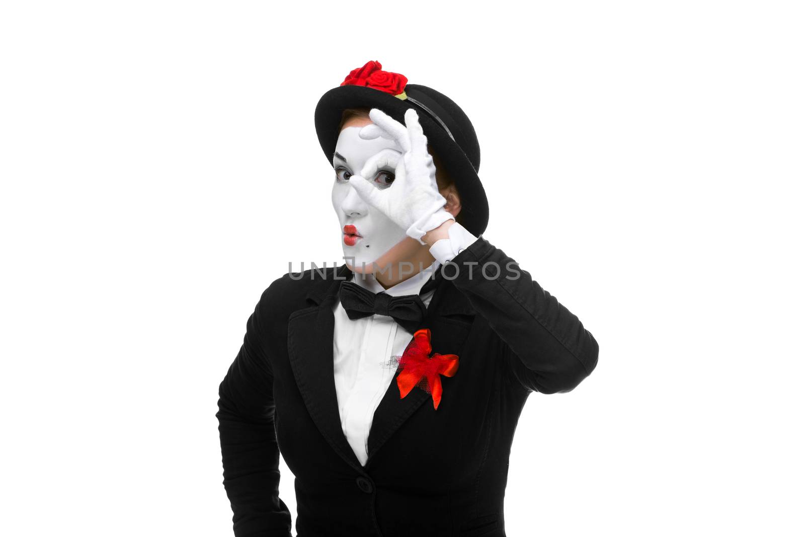 Portrait of the searching woman as mime with hand simulating glasses isolated on white background. Concept intense search