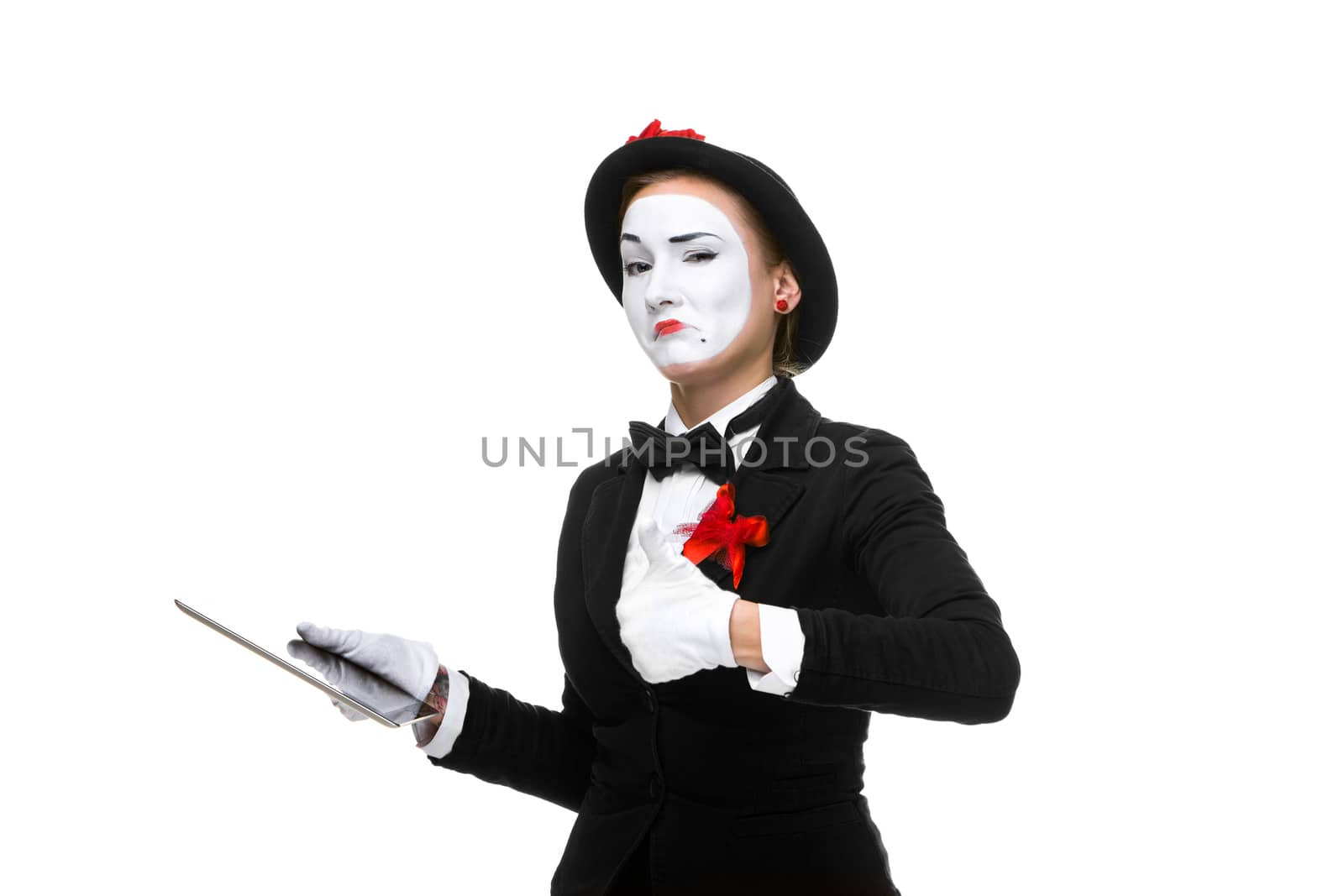 approving business woman in the image mime holding tablet PC isolated on white background