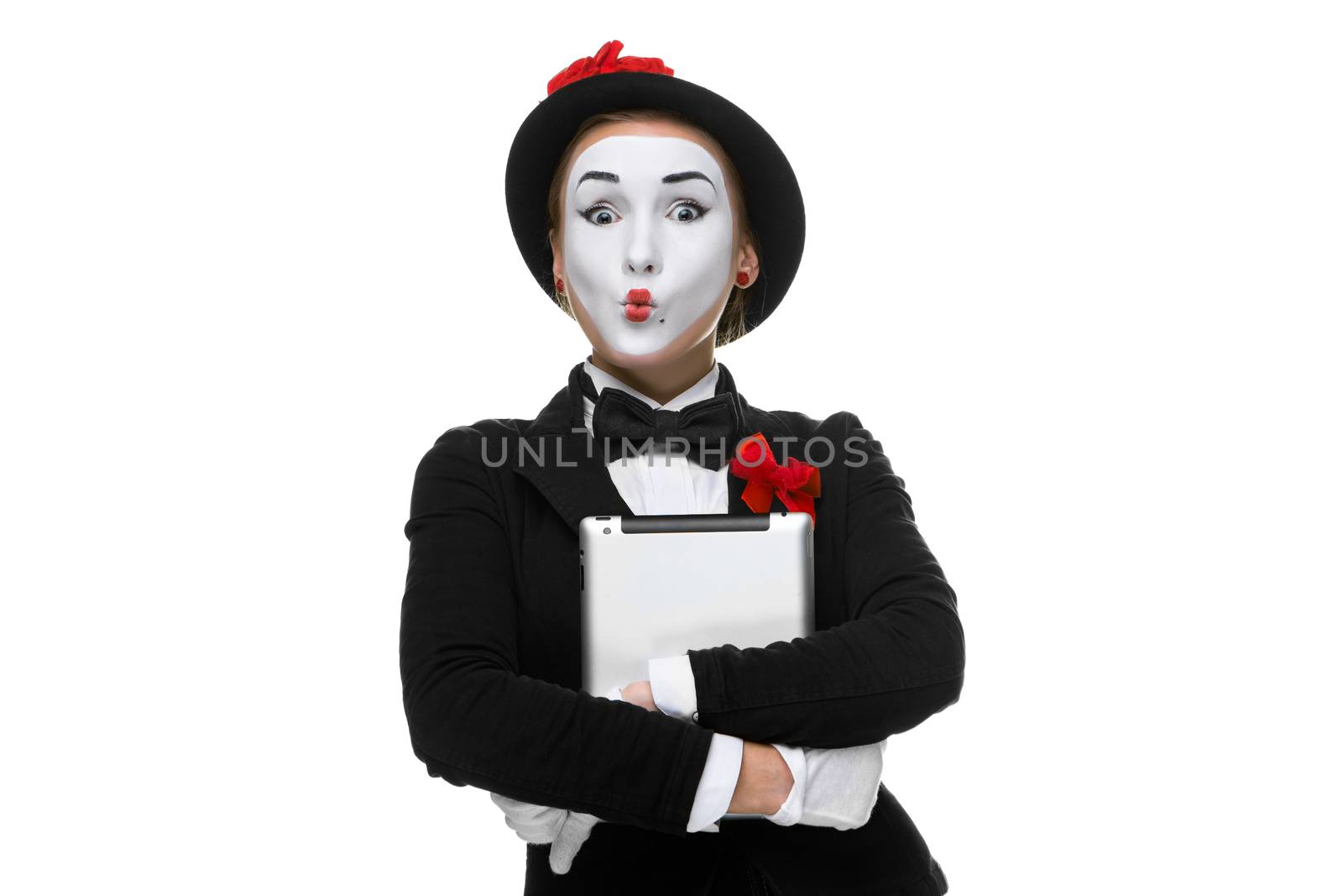 surprised mime with tablet PC in her hands isolated on white  background