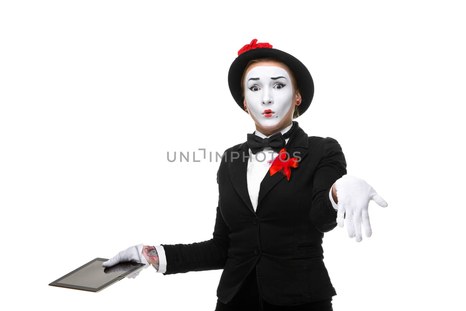 surprised business woman in the image mime holding tablet PC isolated on white background