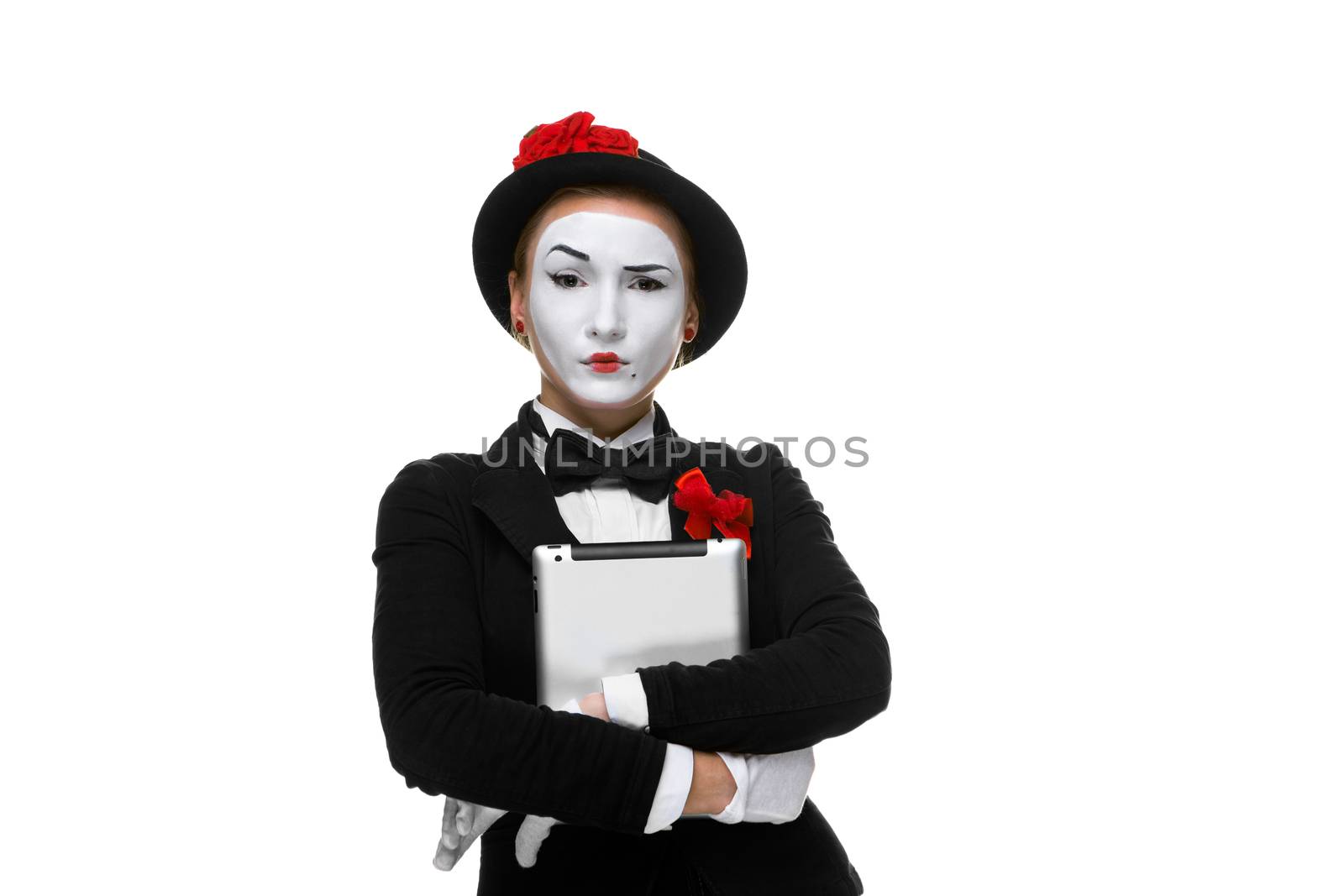business woman in the image mime holding tablet PC and  easy looking at the camera. isolated on white background