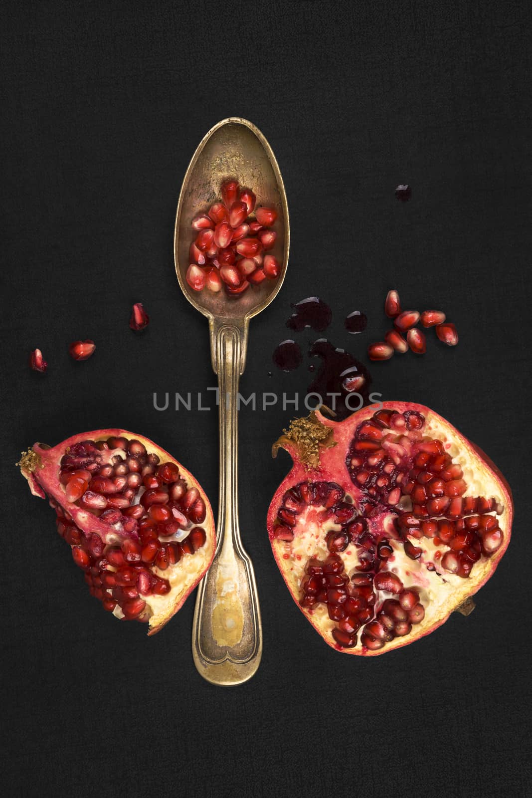 Pomegranate isolated on black background, top view. by eskymaks