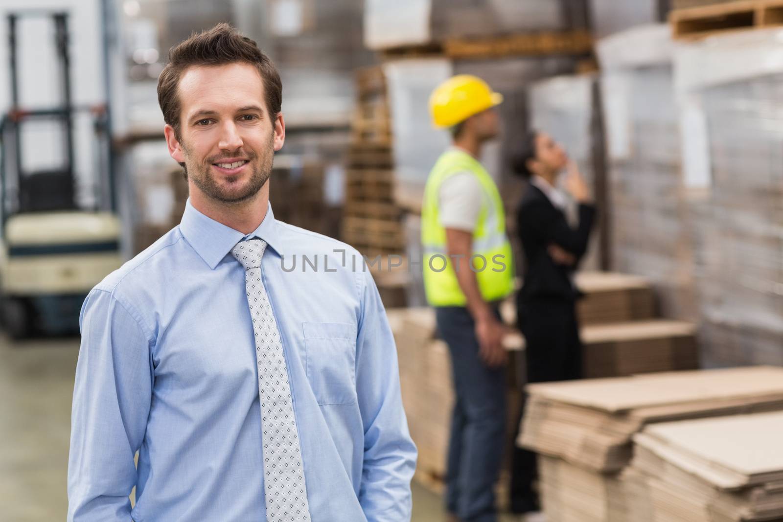 Smiling male manager in warehouse by Wavebreakmedia