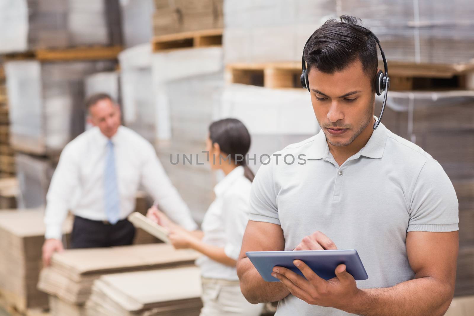 Female manager using digital tablet in warehouse 