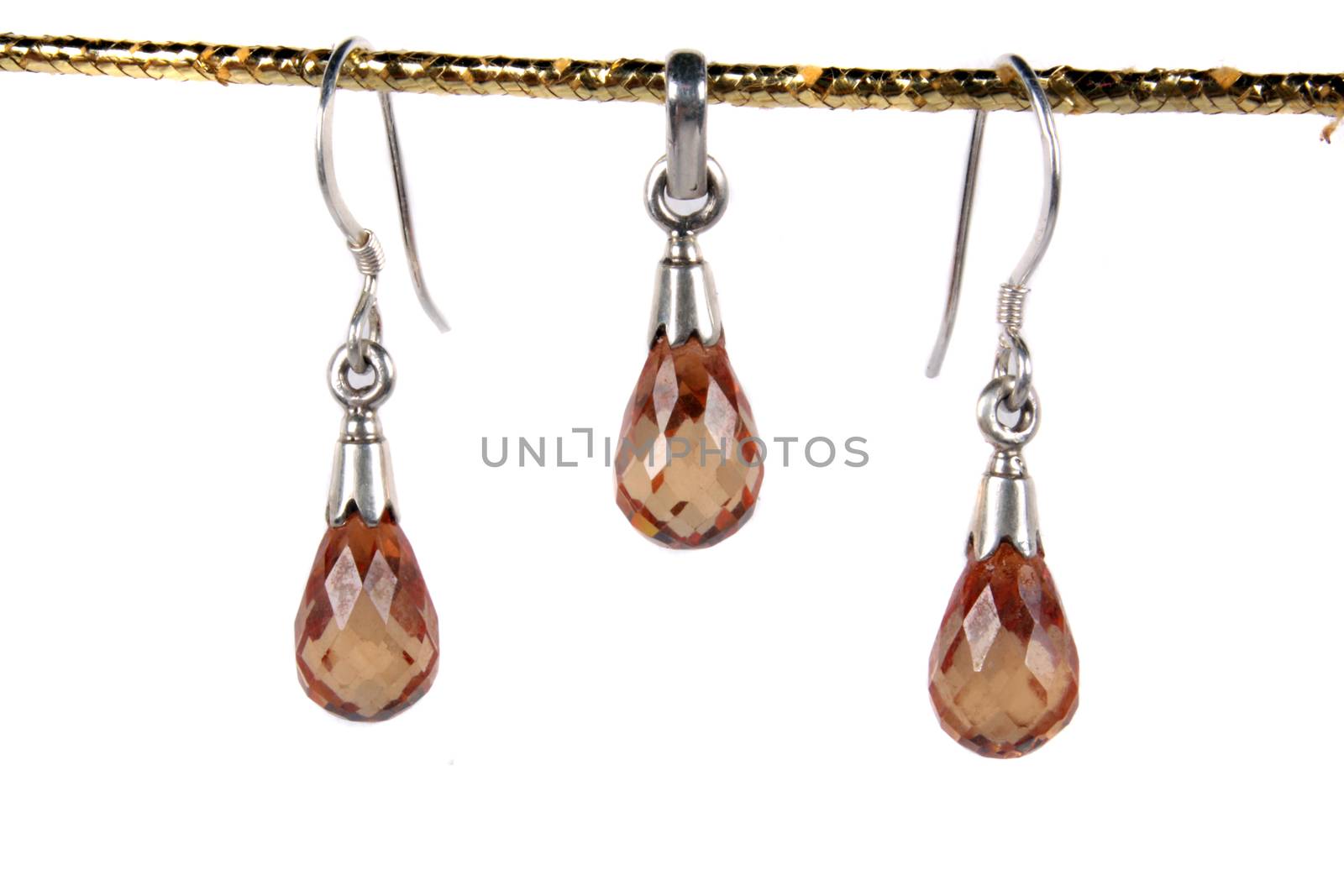 A jewelery set of earrings and pendant made in silver and semi precious gemstones.