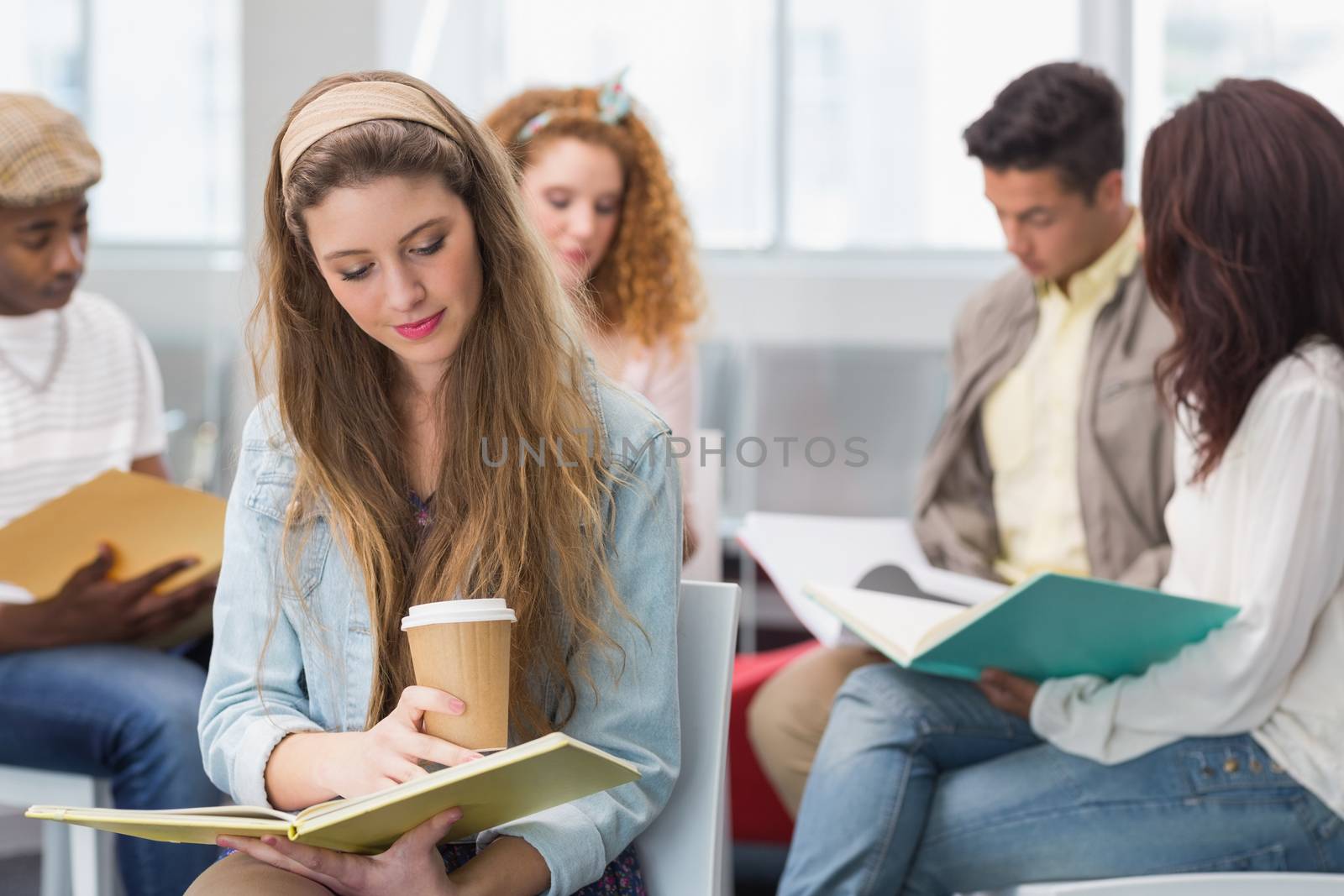 Fashion student reading her notes at the college