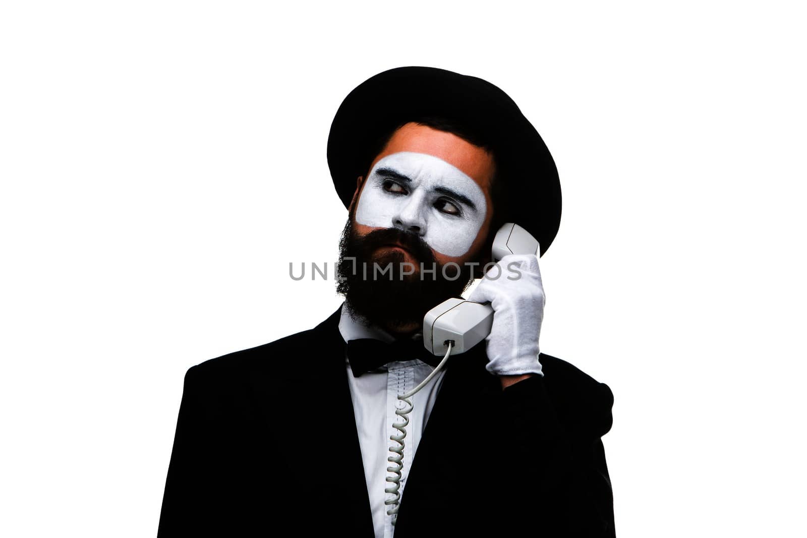 man in the image mime holding a handset isolated on white background. The concept -  submission