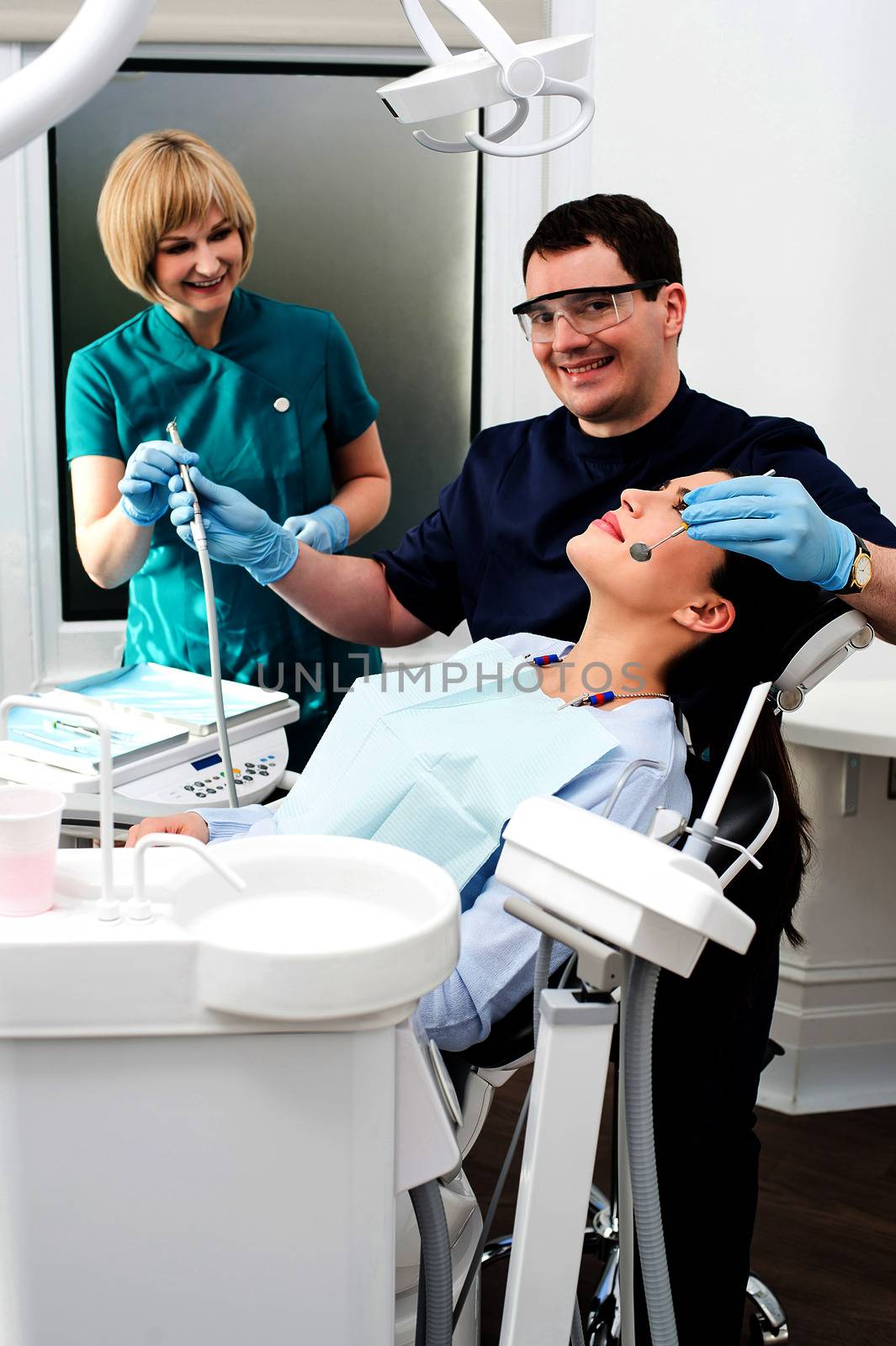 Young woman at the dentist by stockyimages