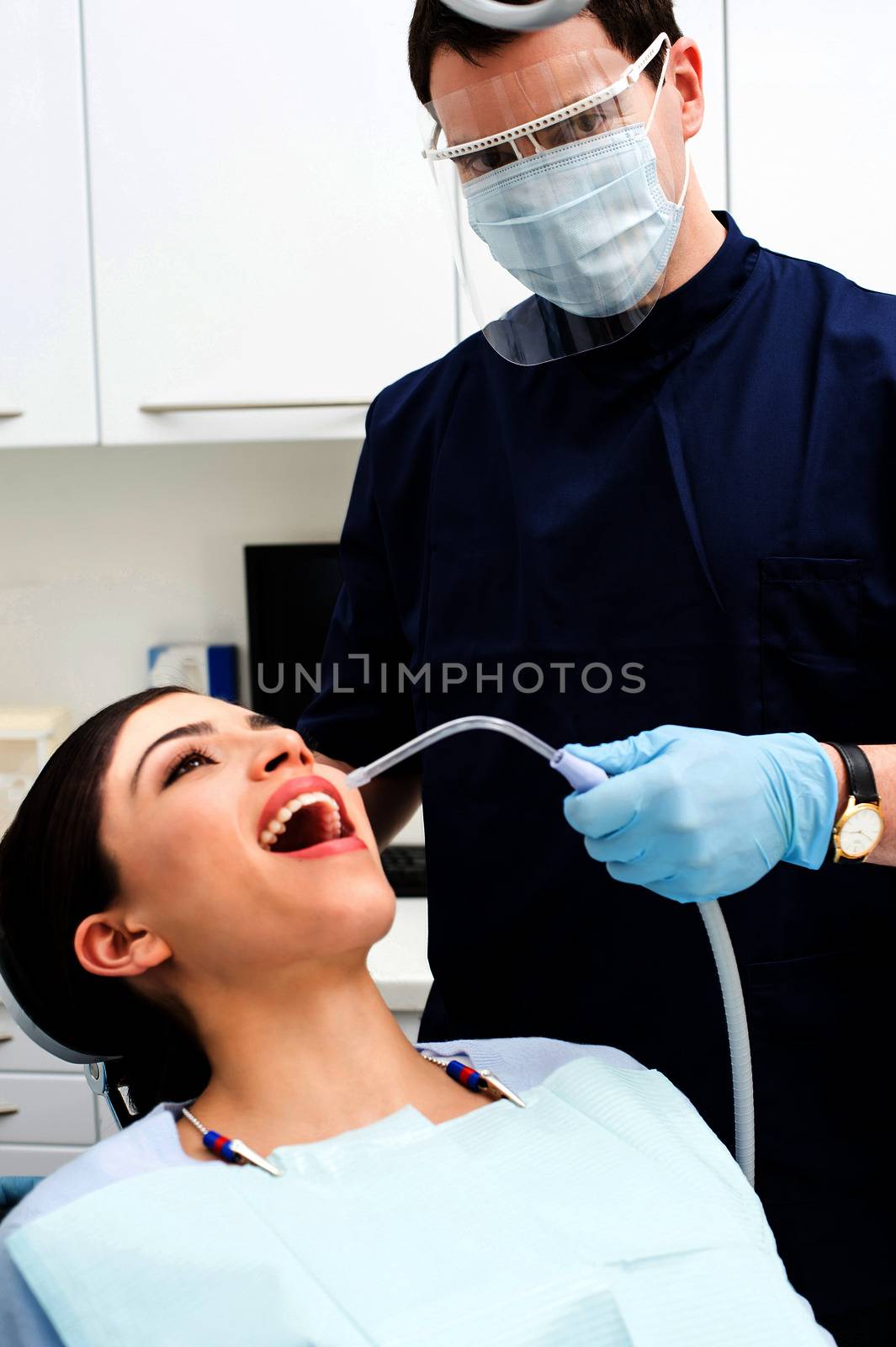 Female patient with dentist in a dental treatment