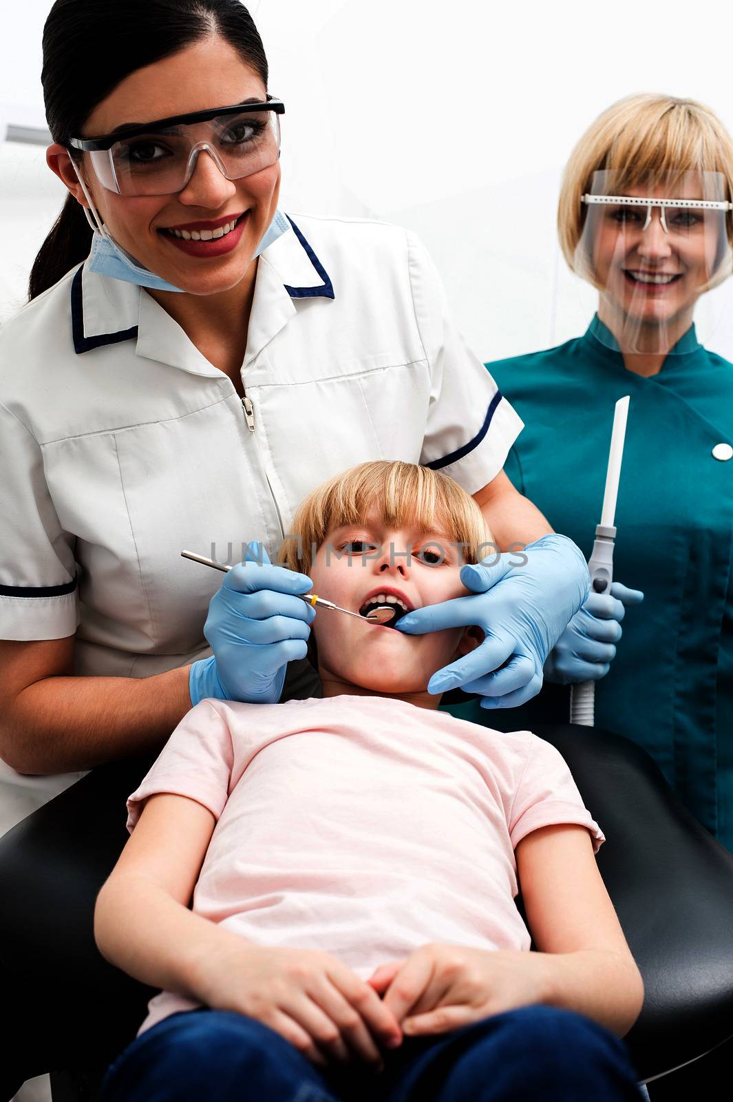Child on her dental check up. by stockyimages