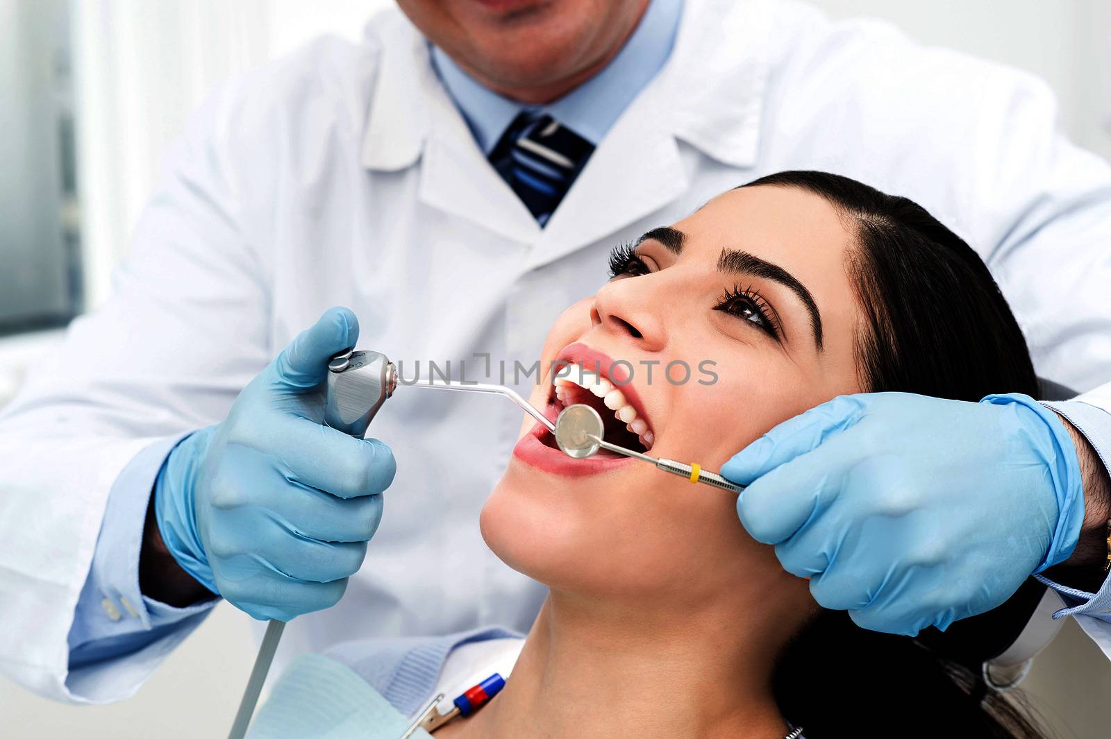 Ddental treatment of female. by stockyimages
