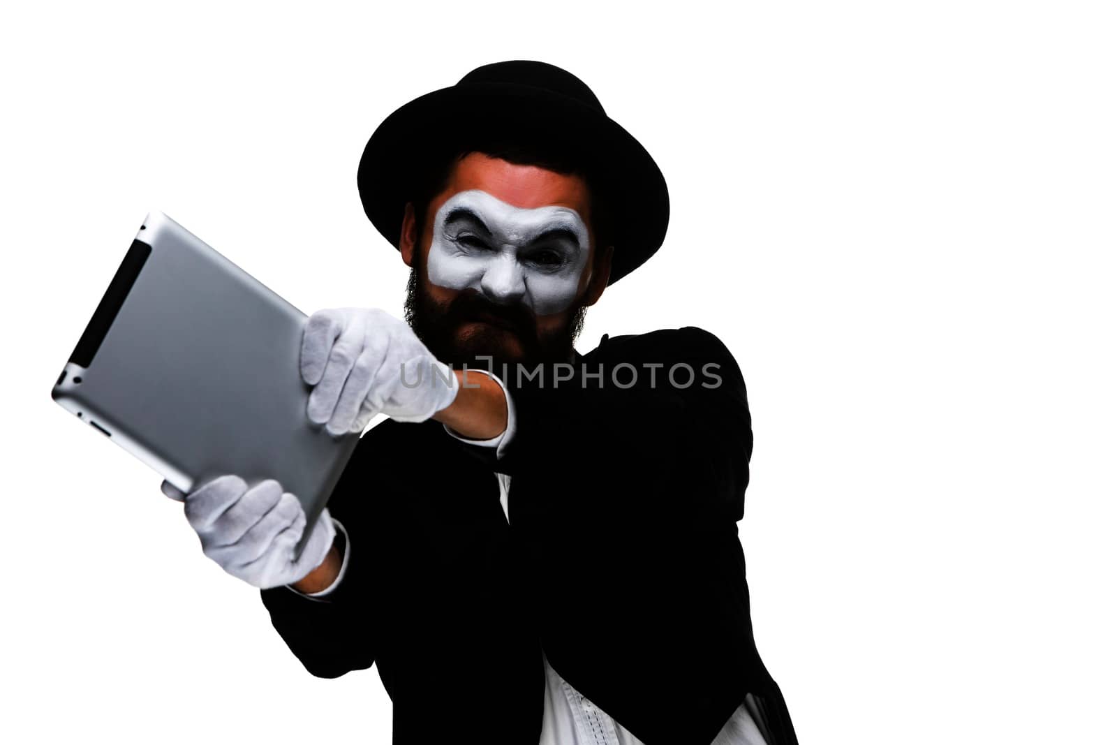 mime as a businessman throws computer in rage. Isolated on white background.  The concept of despair in business.