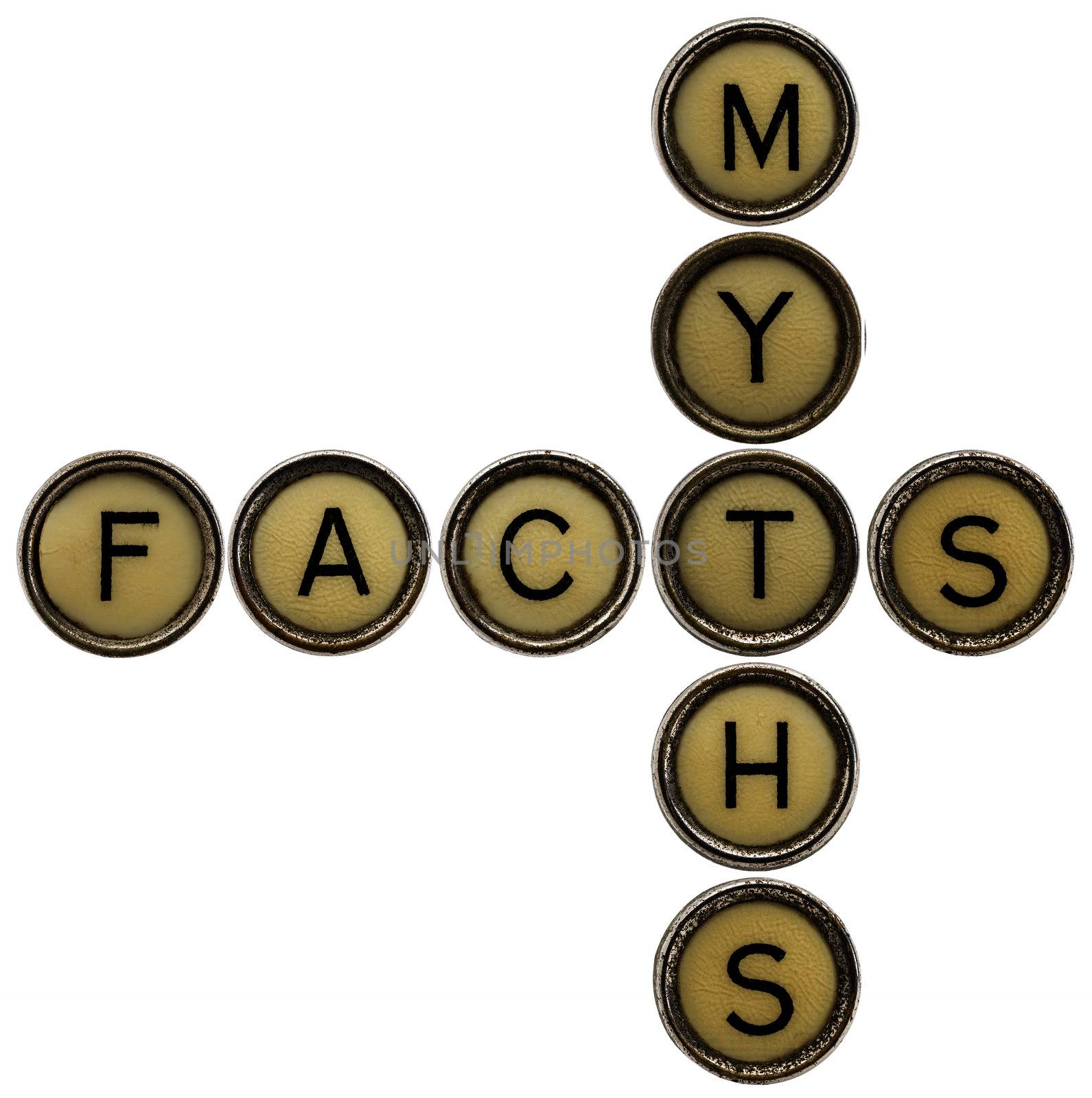 facts and myths  crossword in old round typewriter keys isolated on white