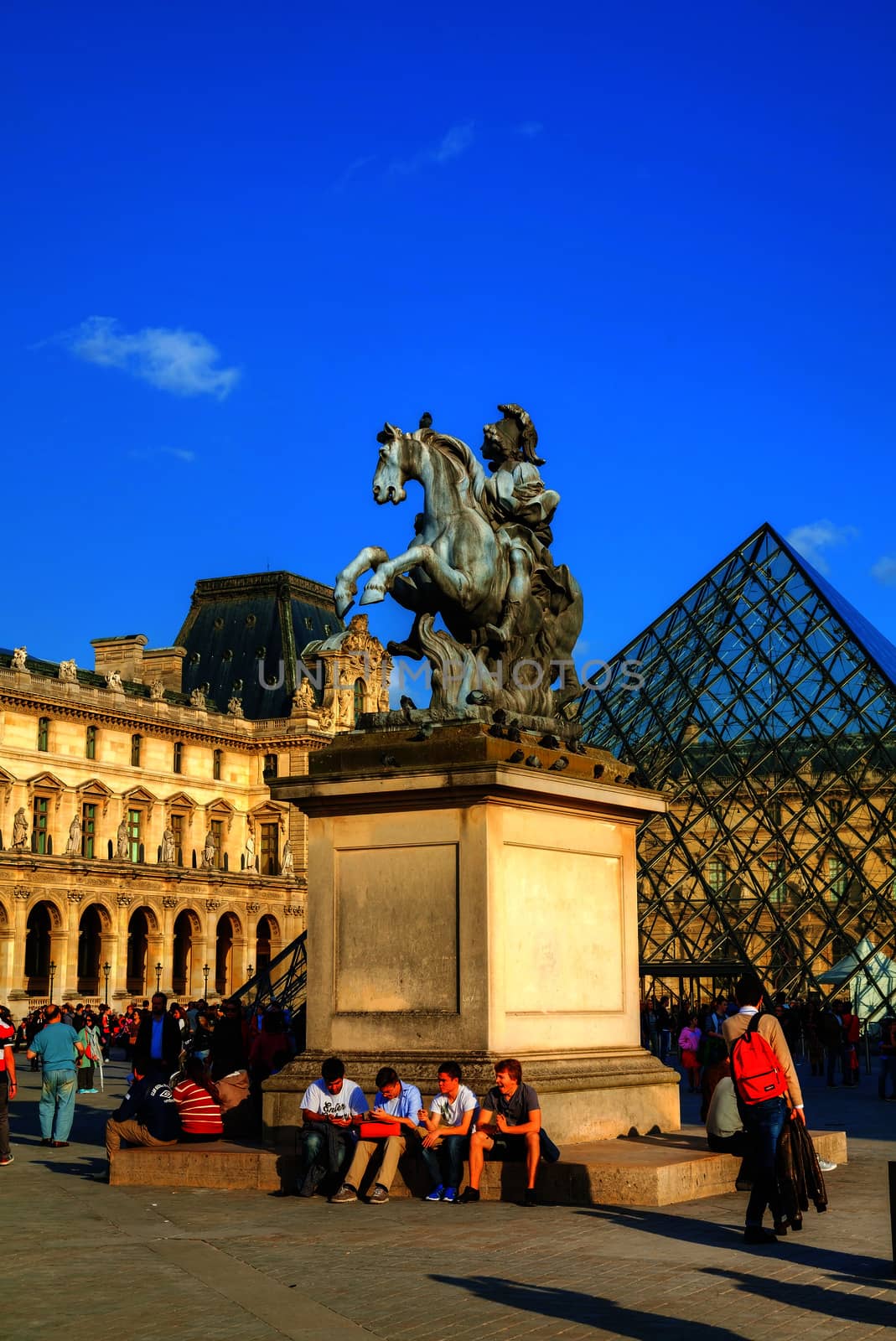 PARIS - OCTOBER 9: Louis XIV statue at the Louvre museum on October 9, 2014 in Paris, France. It's one of the world's largest museums and a historic monument and a central landmark of Paris.