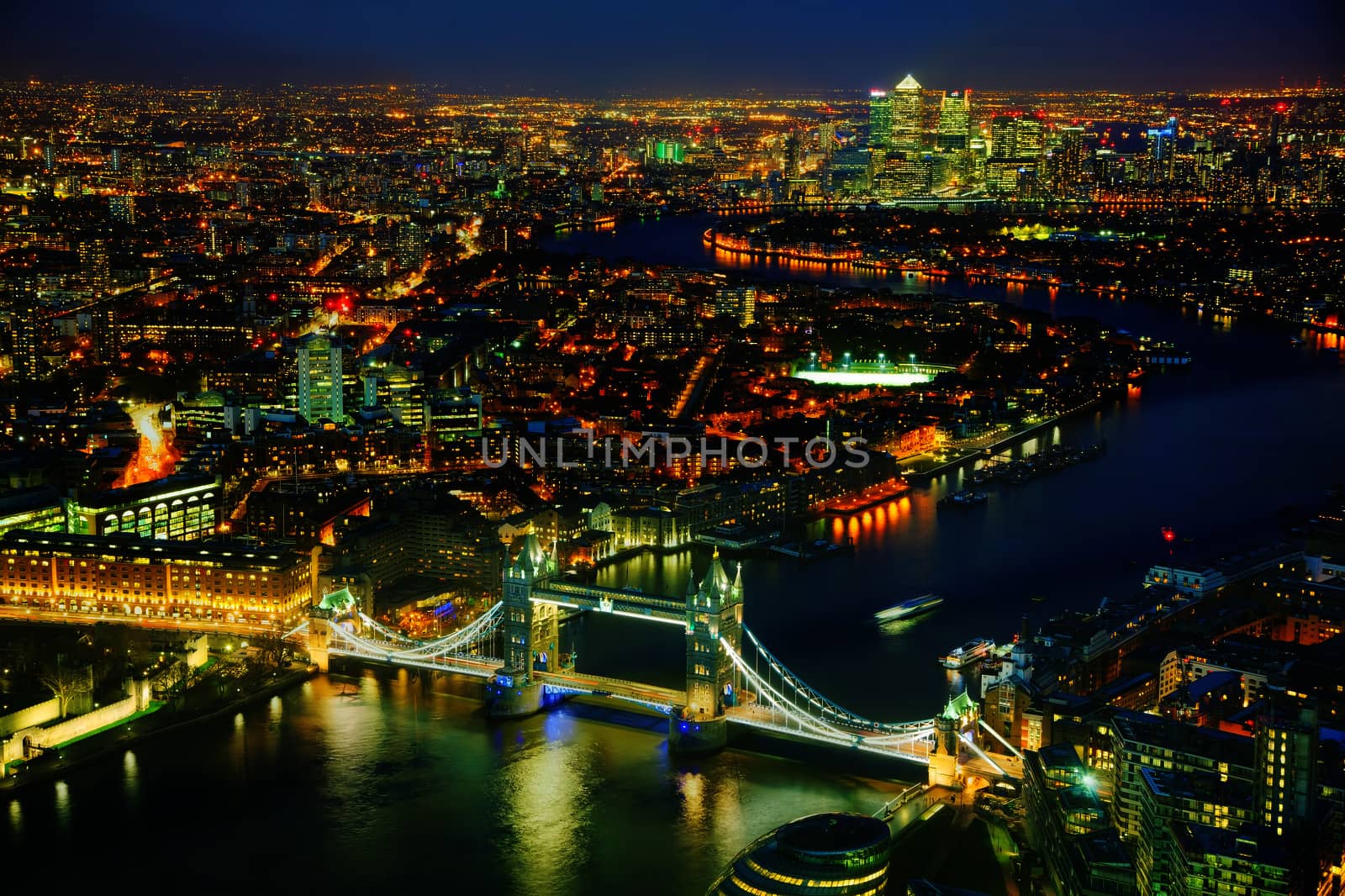 Aerial overview of London city with the Tower bridge at the night time