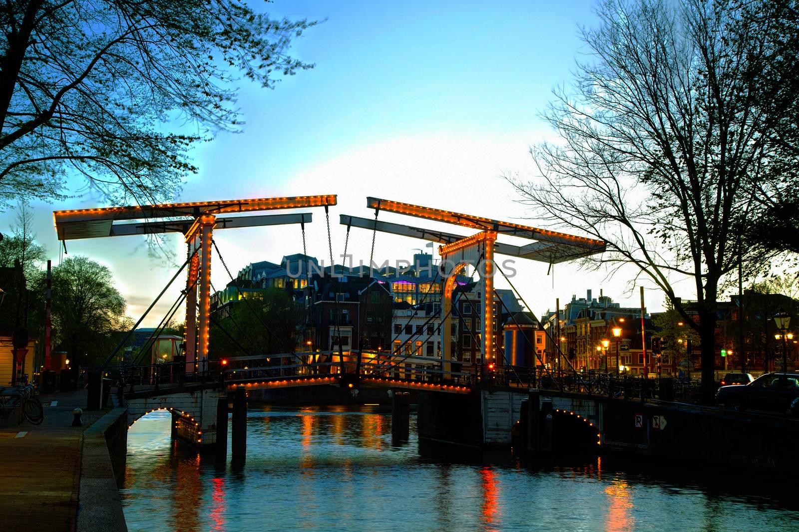 Night city view of Amsterdam, the Netherlands with Amstel river