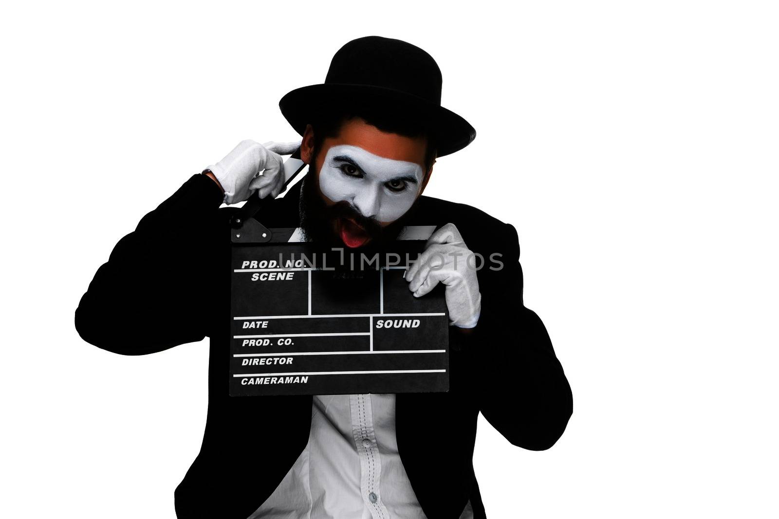 man in the image mime, dressed in black and white suit with movie board, isolated on a white background