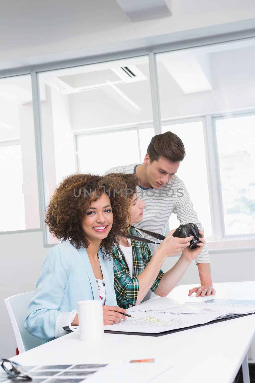 Students working with photos and camera at the college