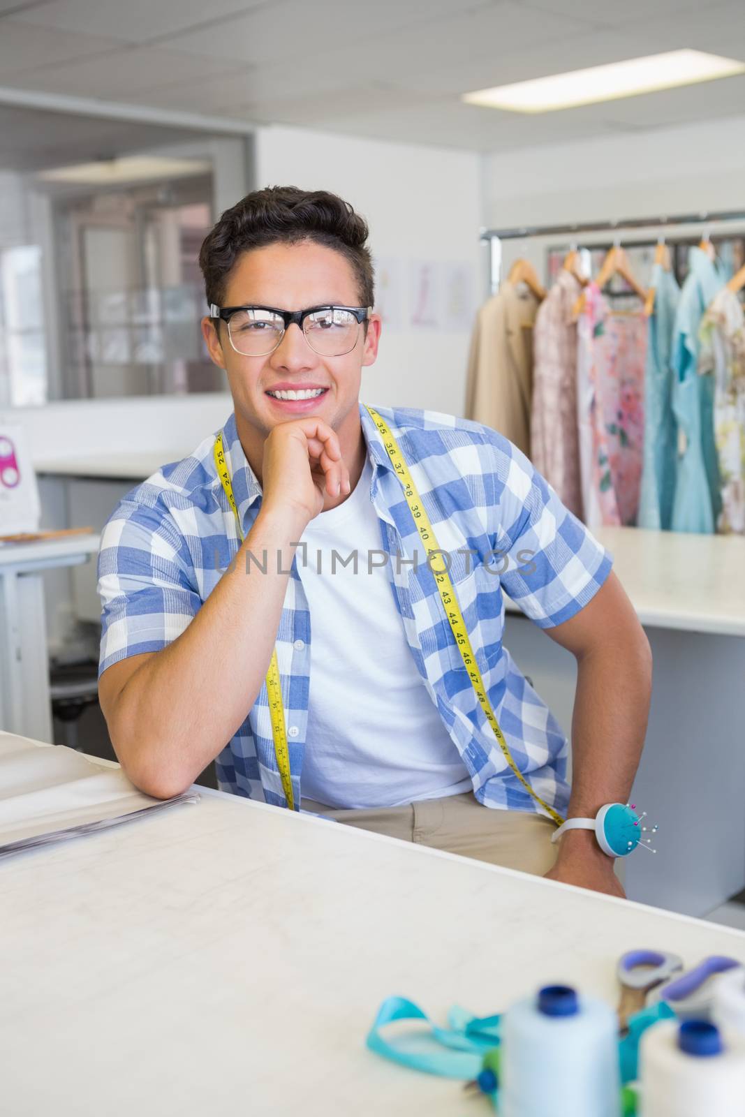 Fashion student with glasses posing by Wavebreakmedia
