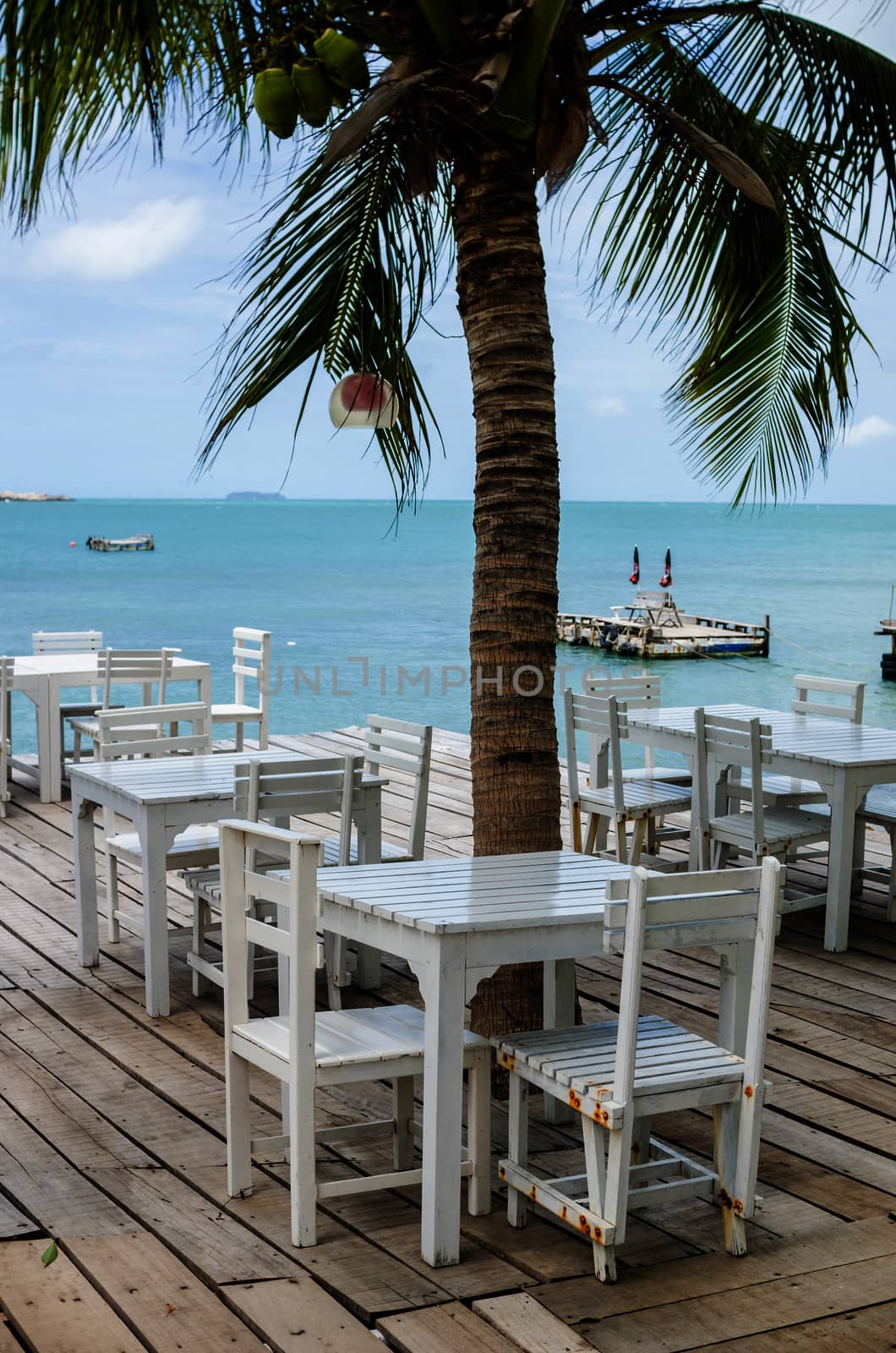 Wood dock White chair and table in Koh Samet Thailand