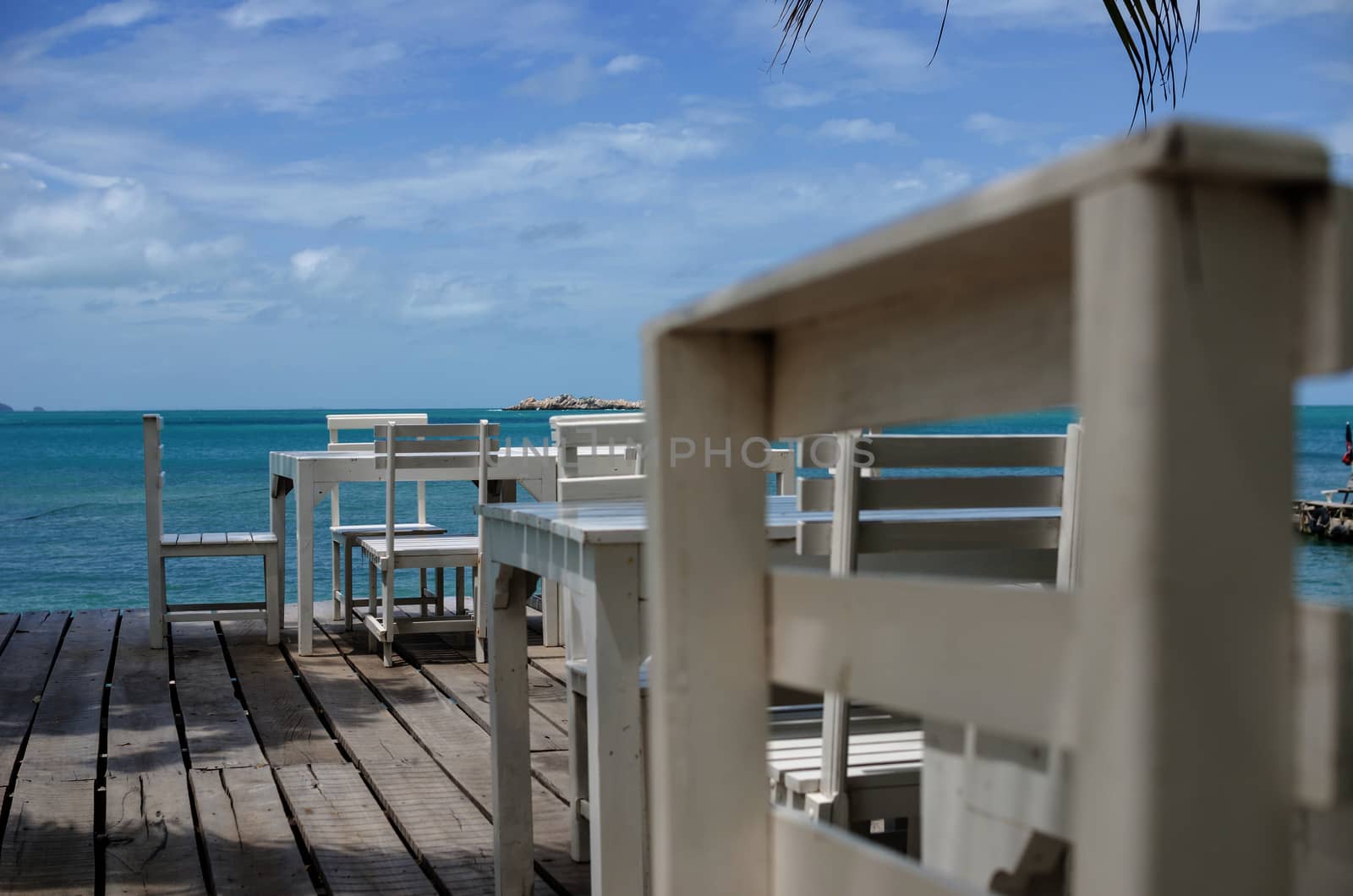 Wood dock White chair and table in Koh Samet Thailand