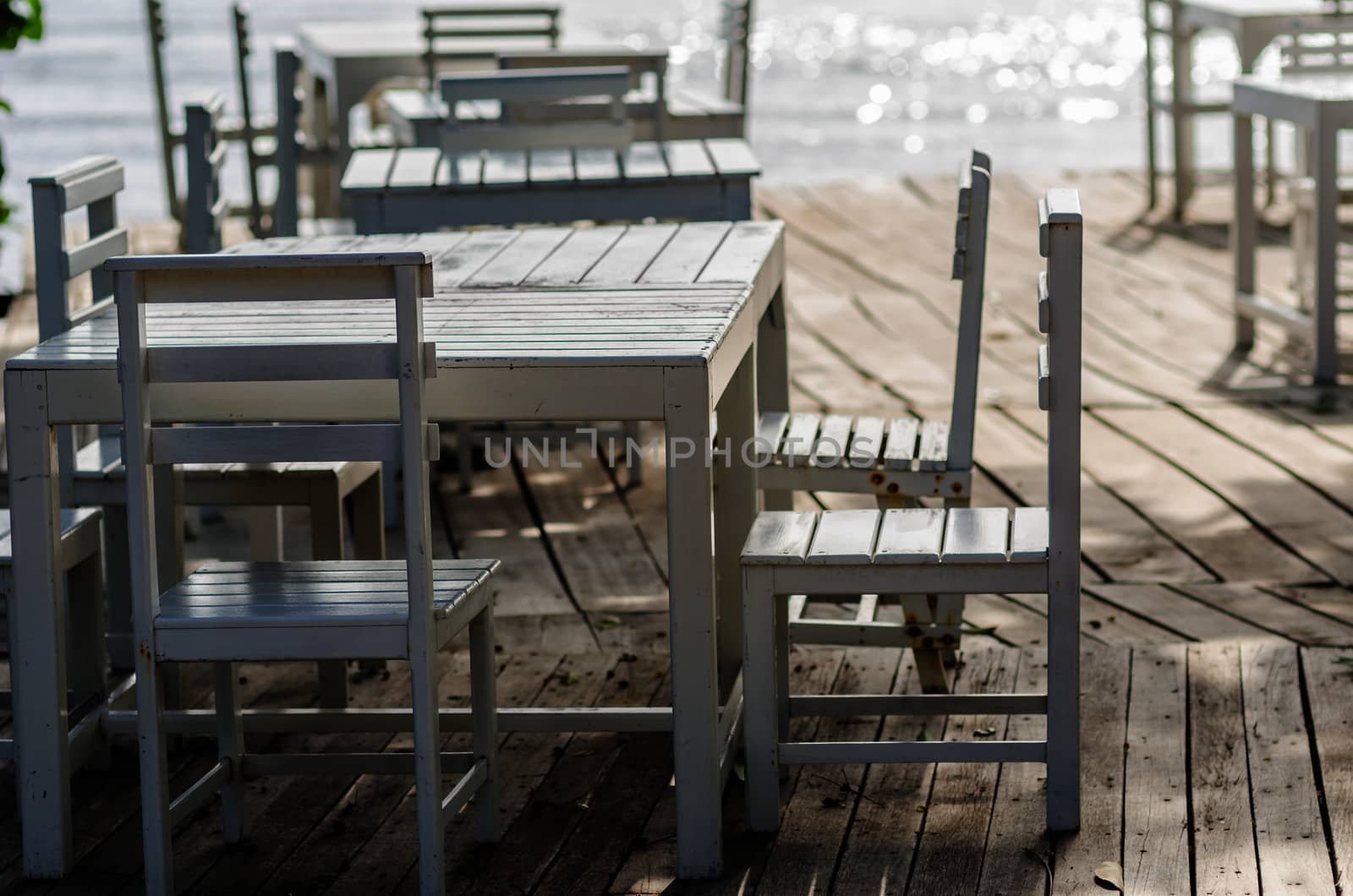 Wood dock White chair and table in Koh Samet Thailand