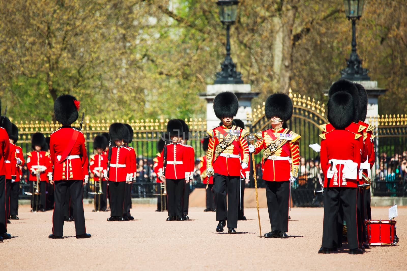 LONDON - APRIL 13: Queen's Guards at the Buckingham palace on April 13, 2015 in London, UK. It's the name given to the contingent of infantry guarding Buckingham Palace and St James's Palace.