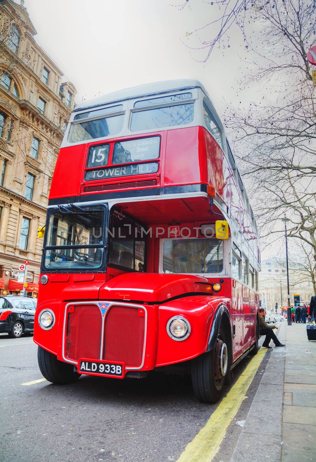 LONDON - APRIL 5: Iconic red double decker bus on April 5, 2015 in London, UK. The London Bus is one of London's principal icons, the archetypal red rear-entrance Routemaster being recognised worldwide.