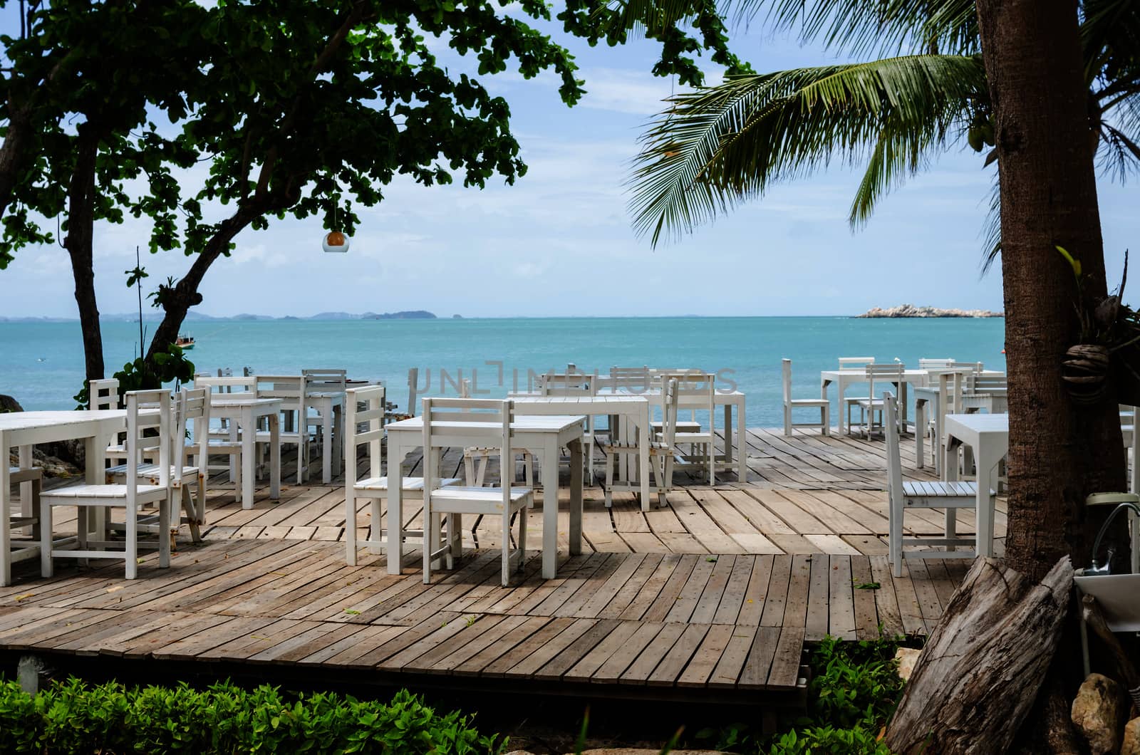 Wood dock White chair and table in Koh Samet Thailand