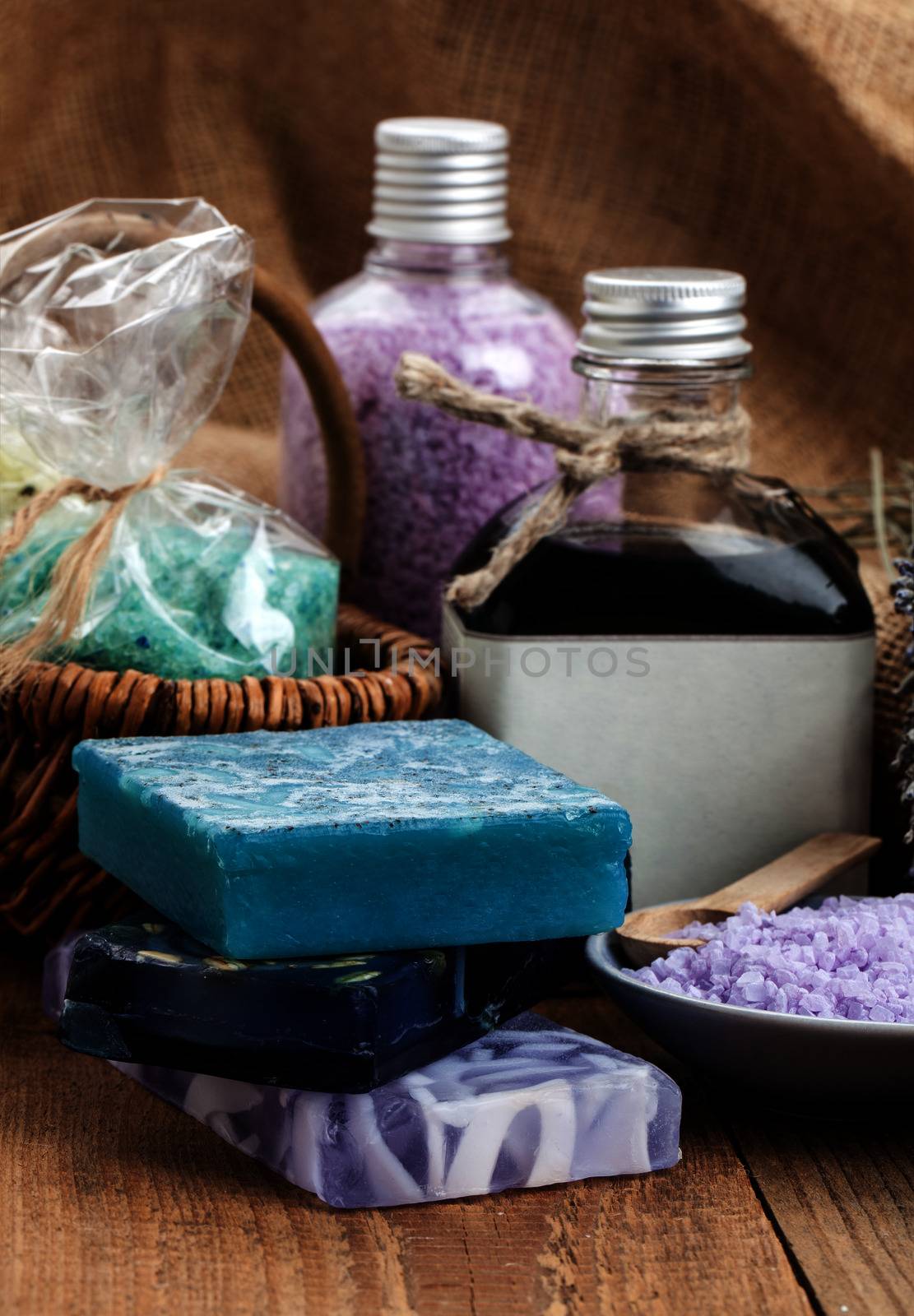 Homemade Soap with Lavender Flowers and Sea Salt, on wooden back by motorolka