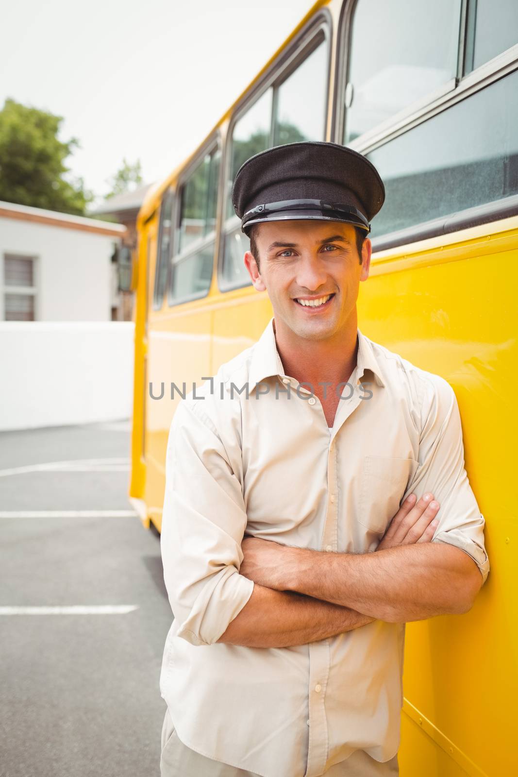 Smiling bus driver looking at camera by Wavebreakmedia