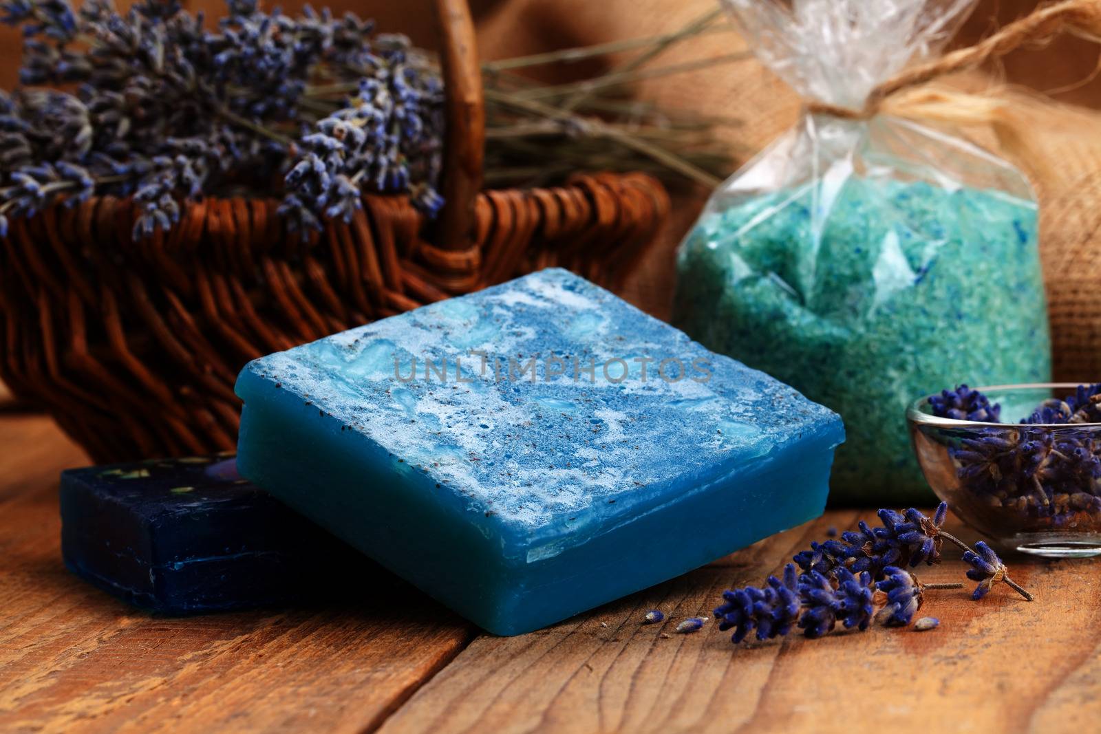 Homemade Soap with Lavender Flowers and Sea Salt, on wooden back by motorolka