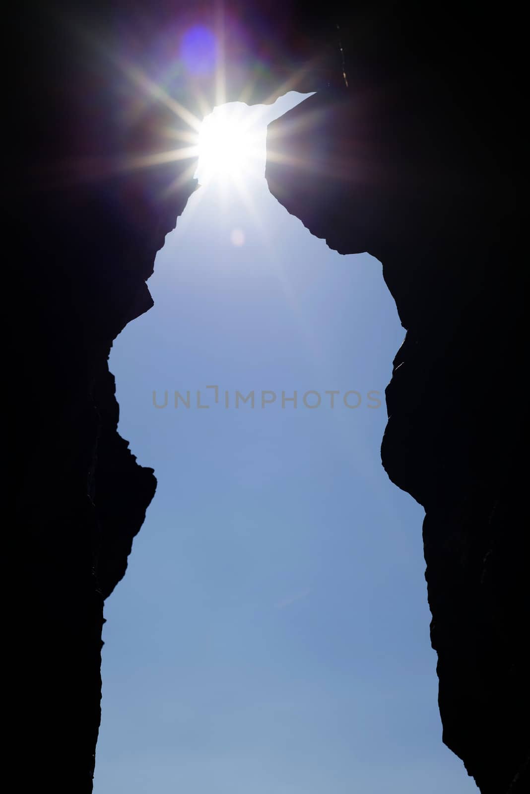 ballybunion cliffs cave entrance and sunshine by morrbyte