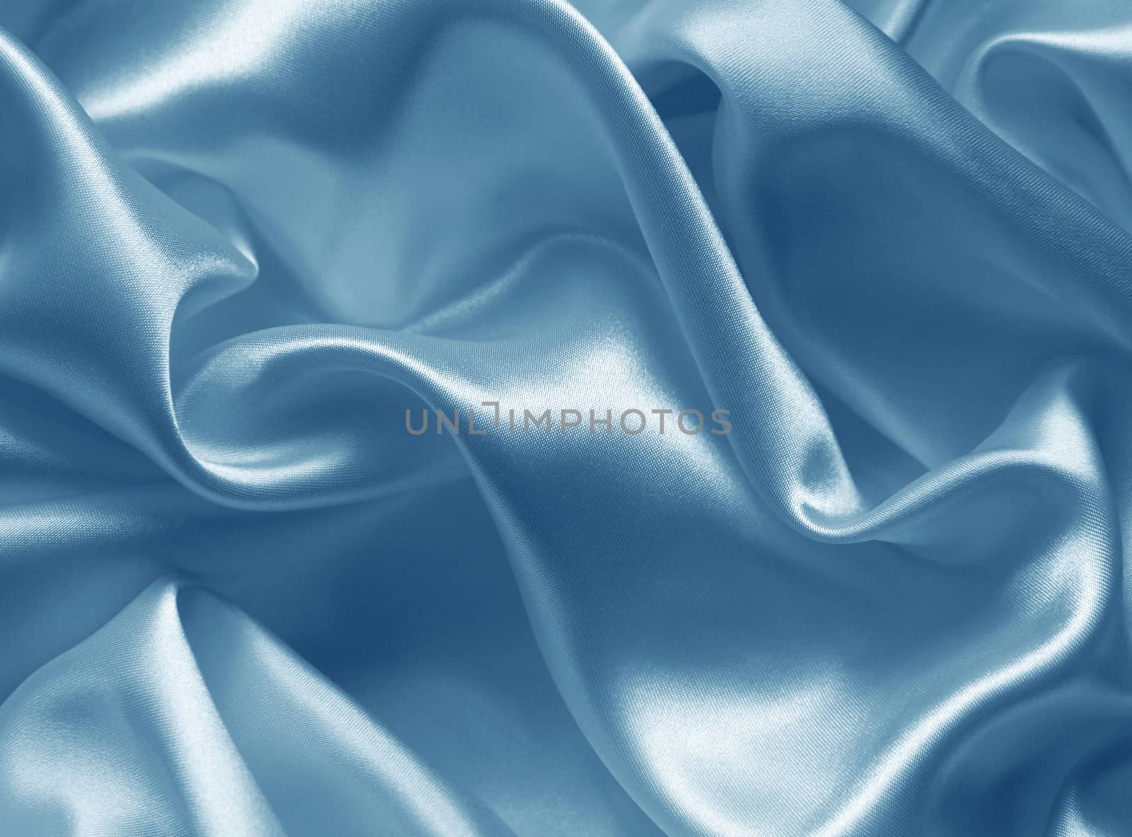 Smooth elegant blue silk or satin as background  by oxanatravel