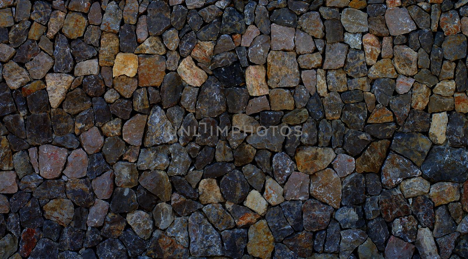 Background of Sharp Grey and Beige Cobblestones closeup Outdoors