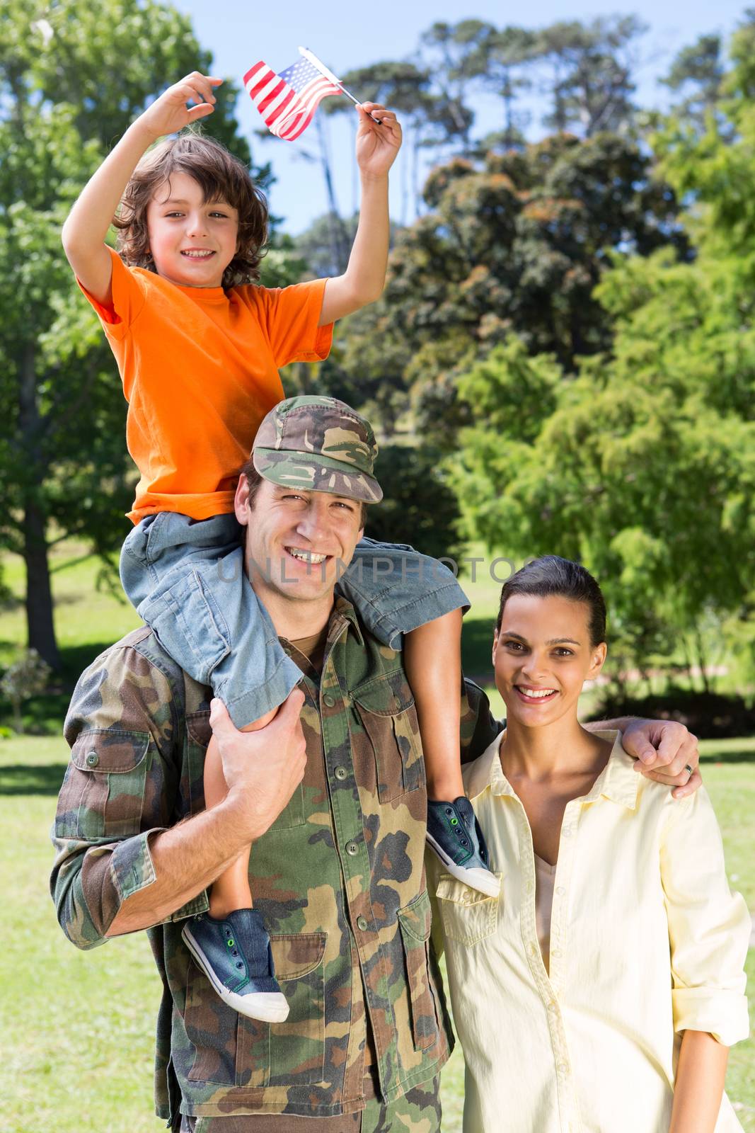 American soldier reunited with family on a sunny day