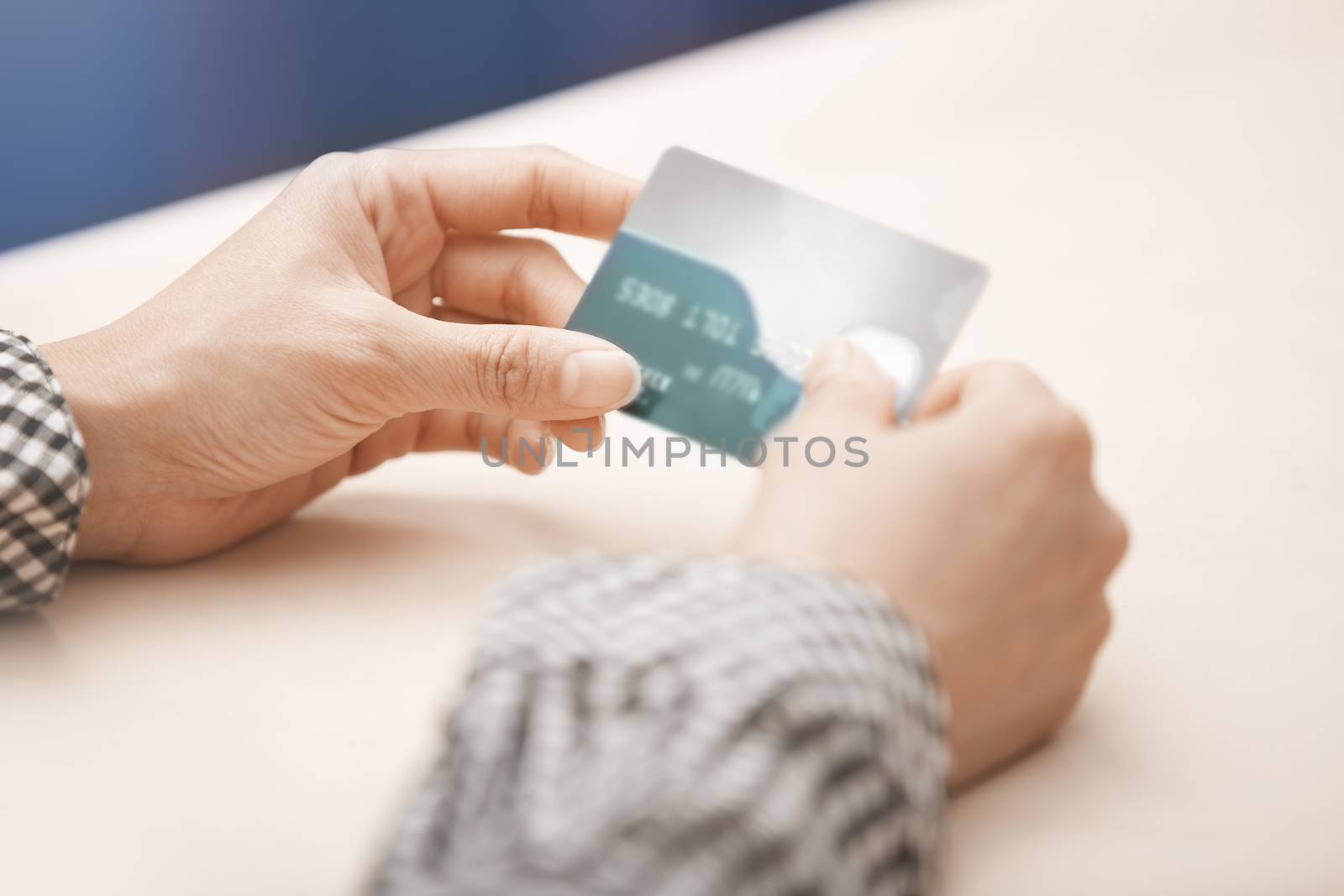 Woman holding two plastic credit cards. Horizontal photo