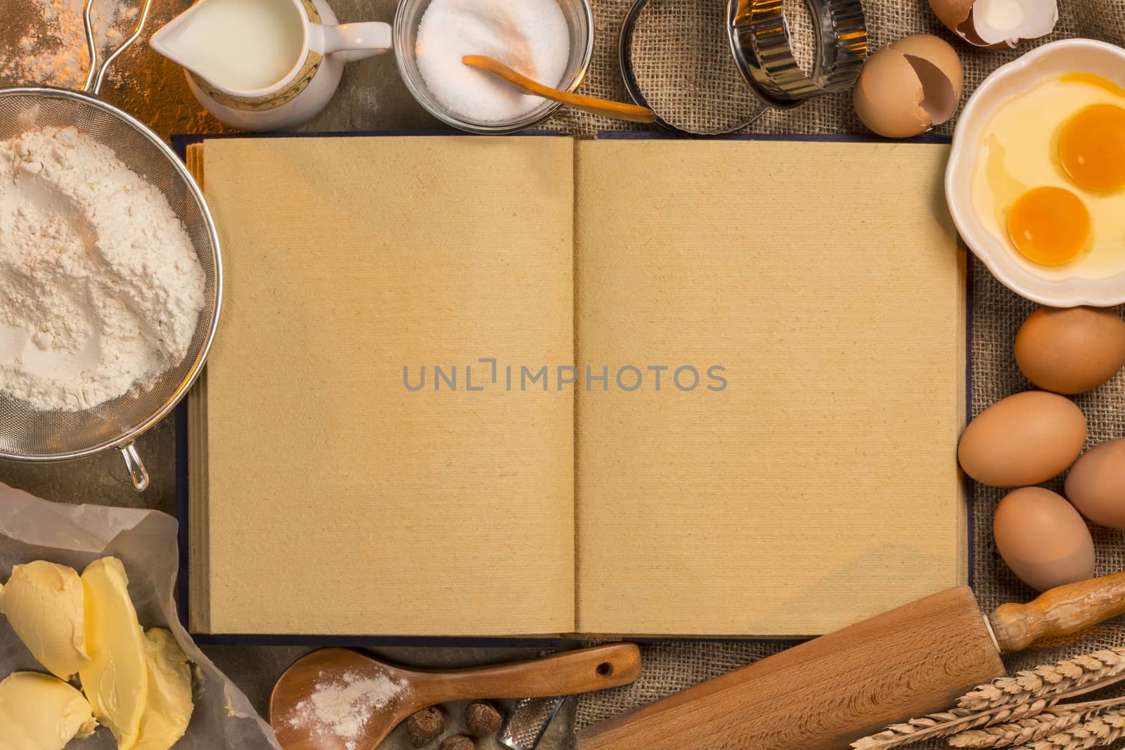 Blank recipe book pages (space for text) with baking ingredients and utensils.