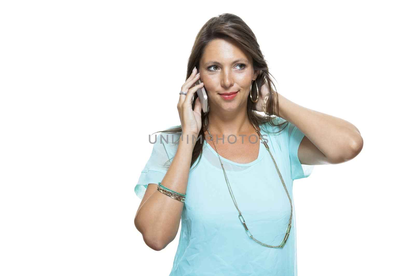 Portrait of Pretty Happy Woman in Casual Clothing Looking Something at her Mobile Phone on Hand. Captures in Studio with White Background.