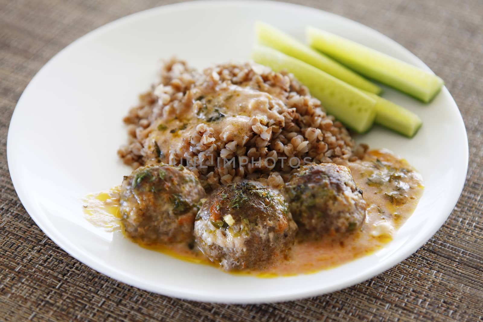 Buckwheat with small meat balls, red souse and fresh cucumbers
