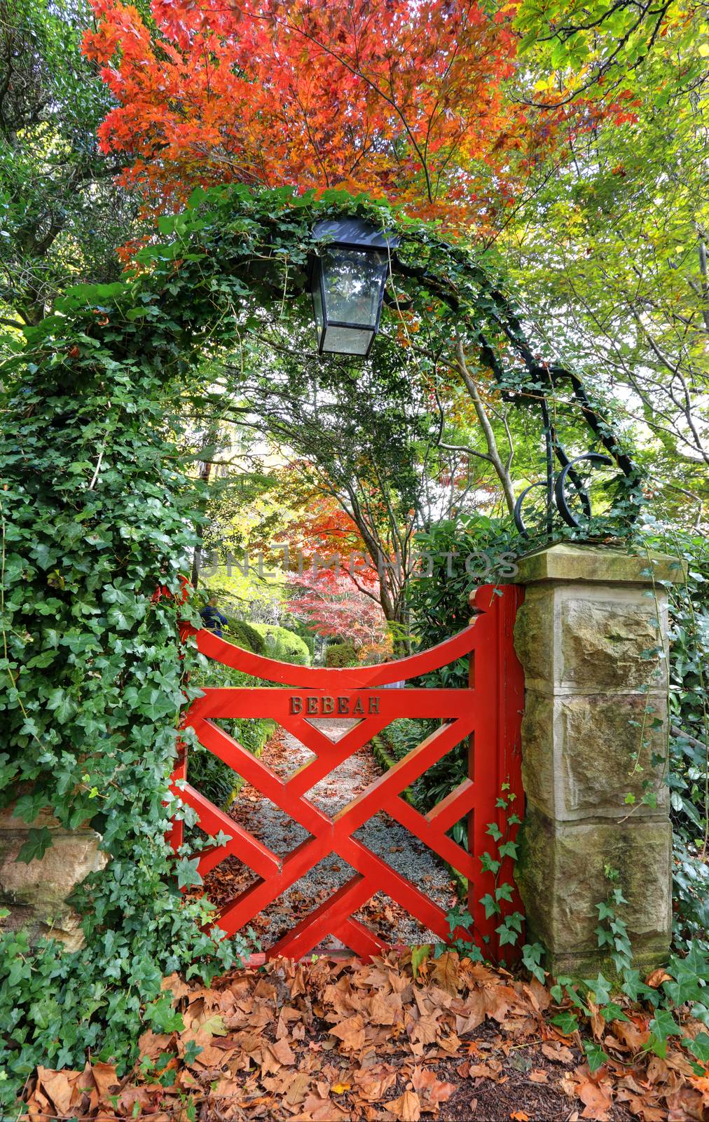 The little red gate at Bebeah Gardens in Autumn.  The parklands were originally built by Edward Cox in 1880.  Sprawling over many acres the garden includes various vistas of formal country garden. Mt Wilson