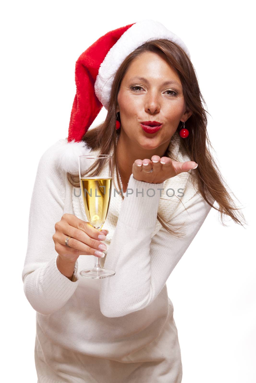 Playful woman celebrating Xmas blowing a kiss by juniart