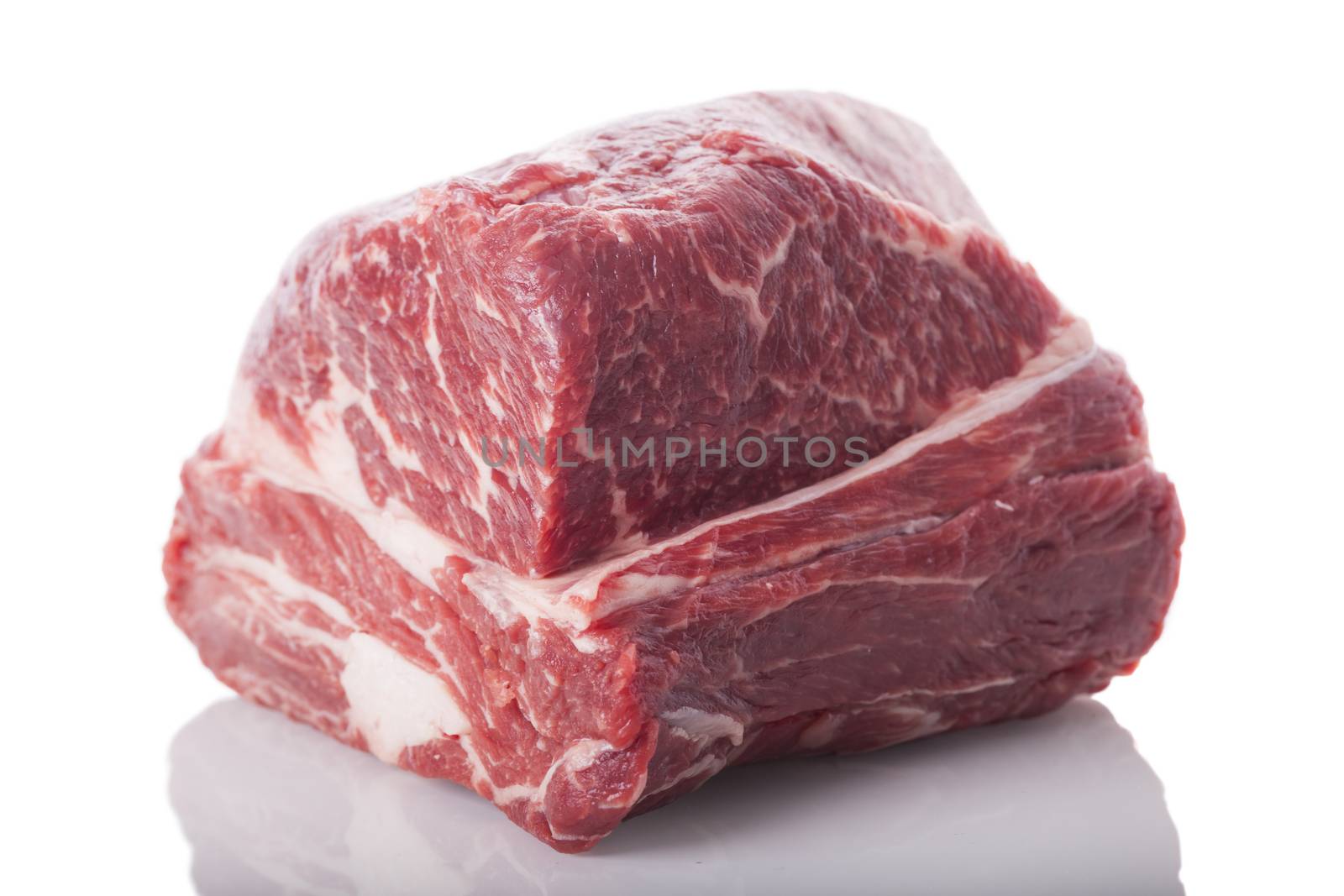 Fresh Slice of Protein Rich Raw Beef Meat on Top of the Table on White Background