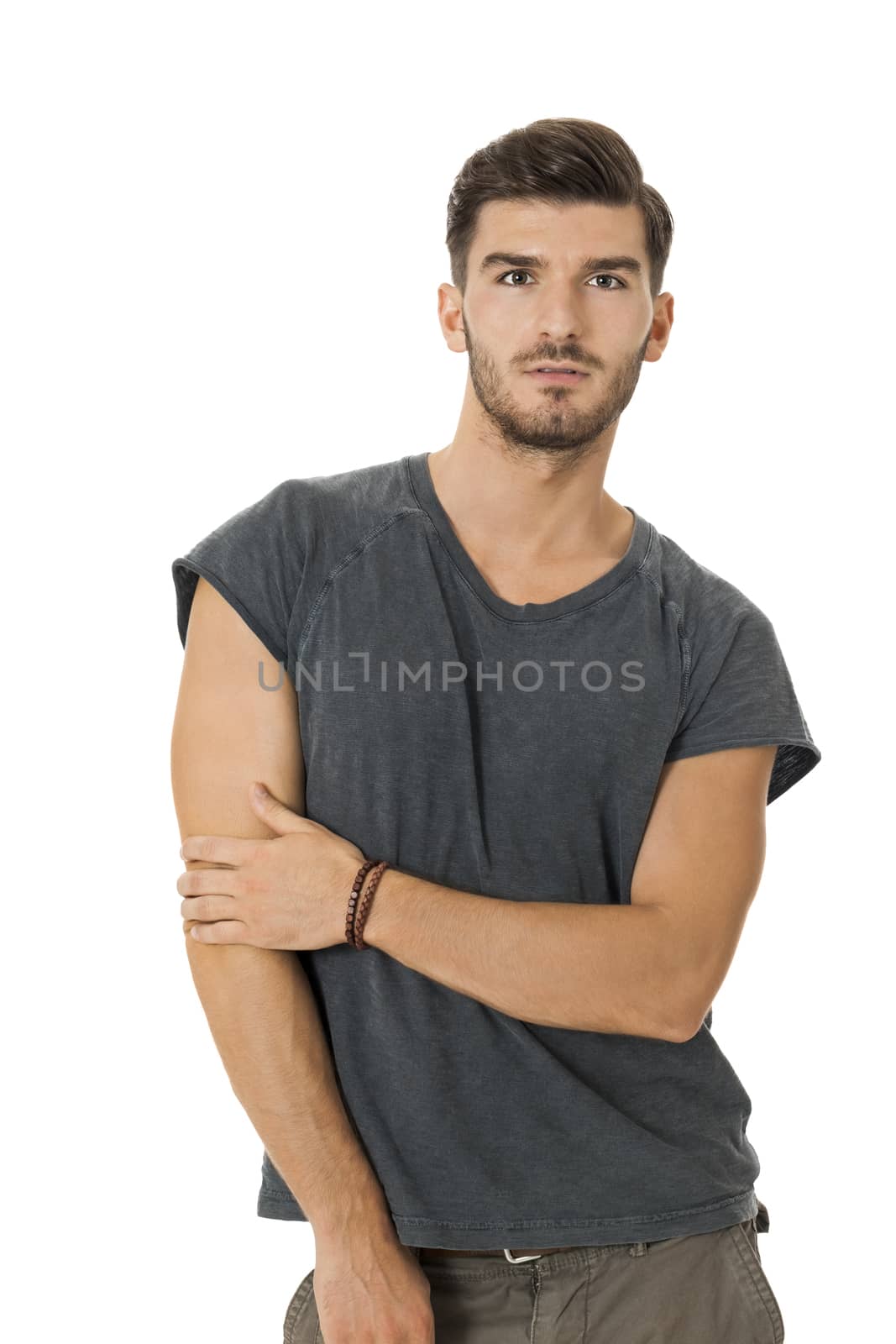 Handsome bearded young man with a lovely charismatic smile wearing a cotton t-shirt, isolated on white