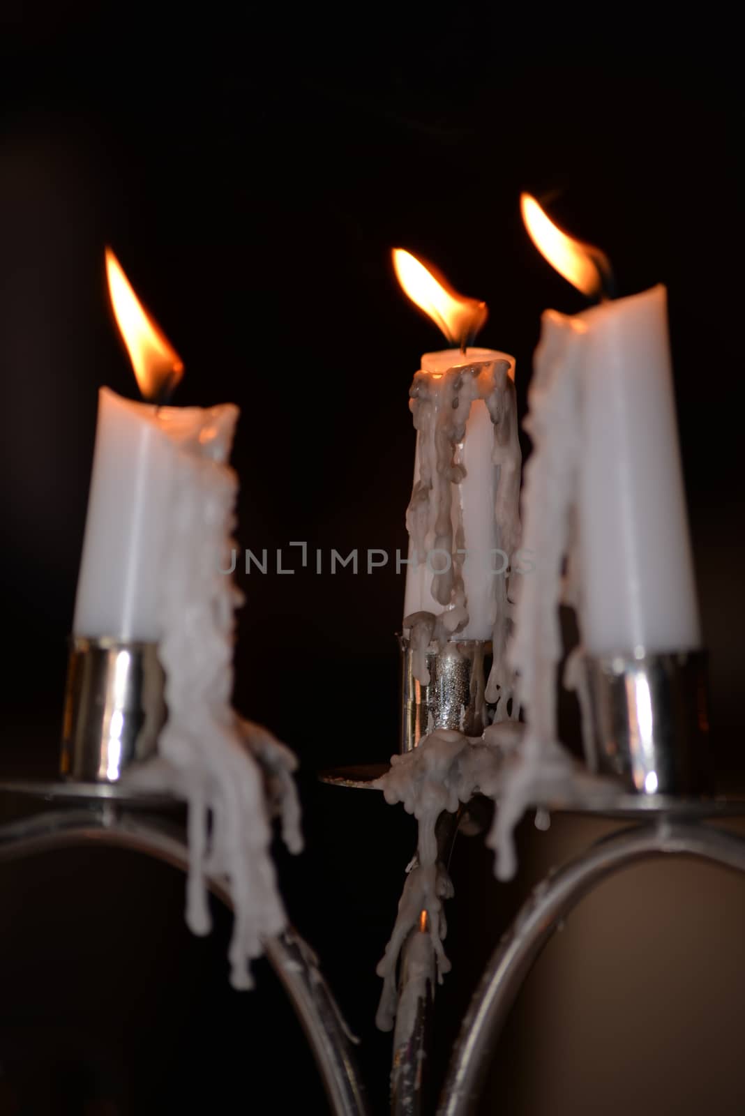 candles lighting and dripping at a restaurant