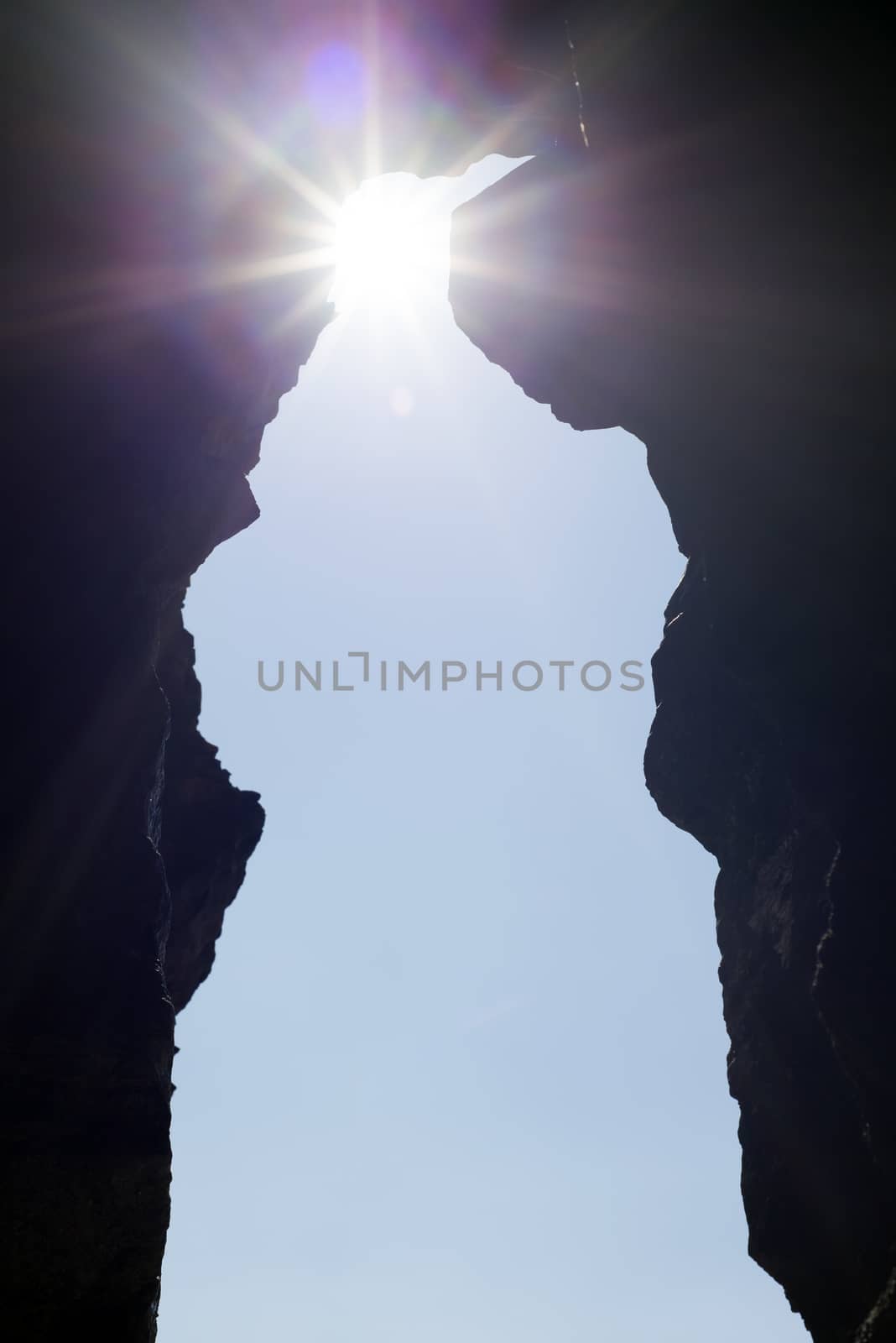 cave entrance in the ballybunion cliffs on the wild atlantic way with sunbeams