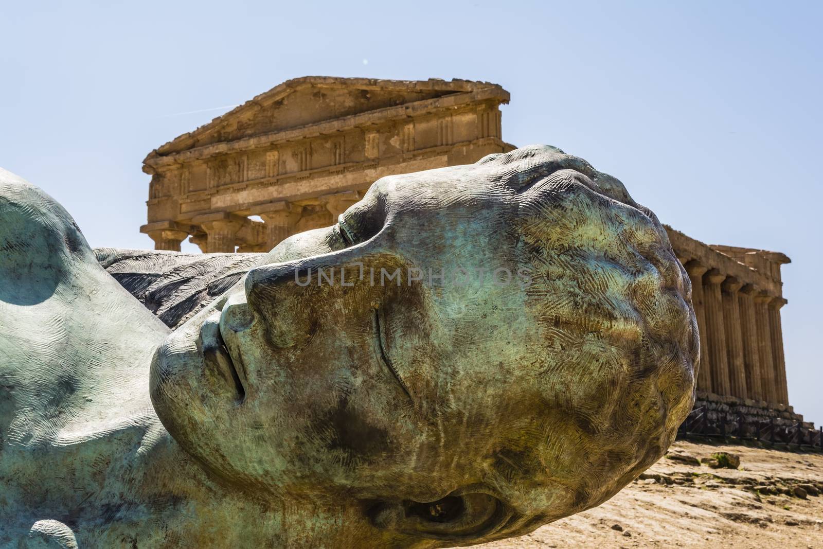 Concordia Temple behind the bronze sculpture of Icarus, person of greek mythology - Valley of the temples 