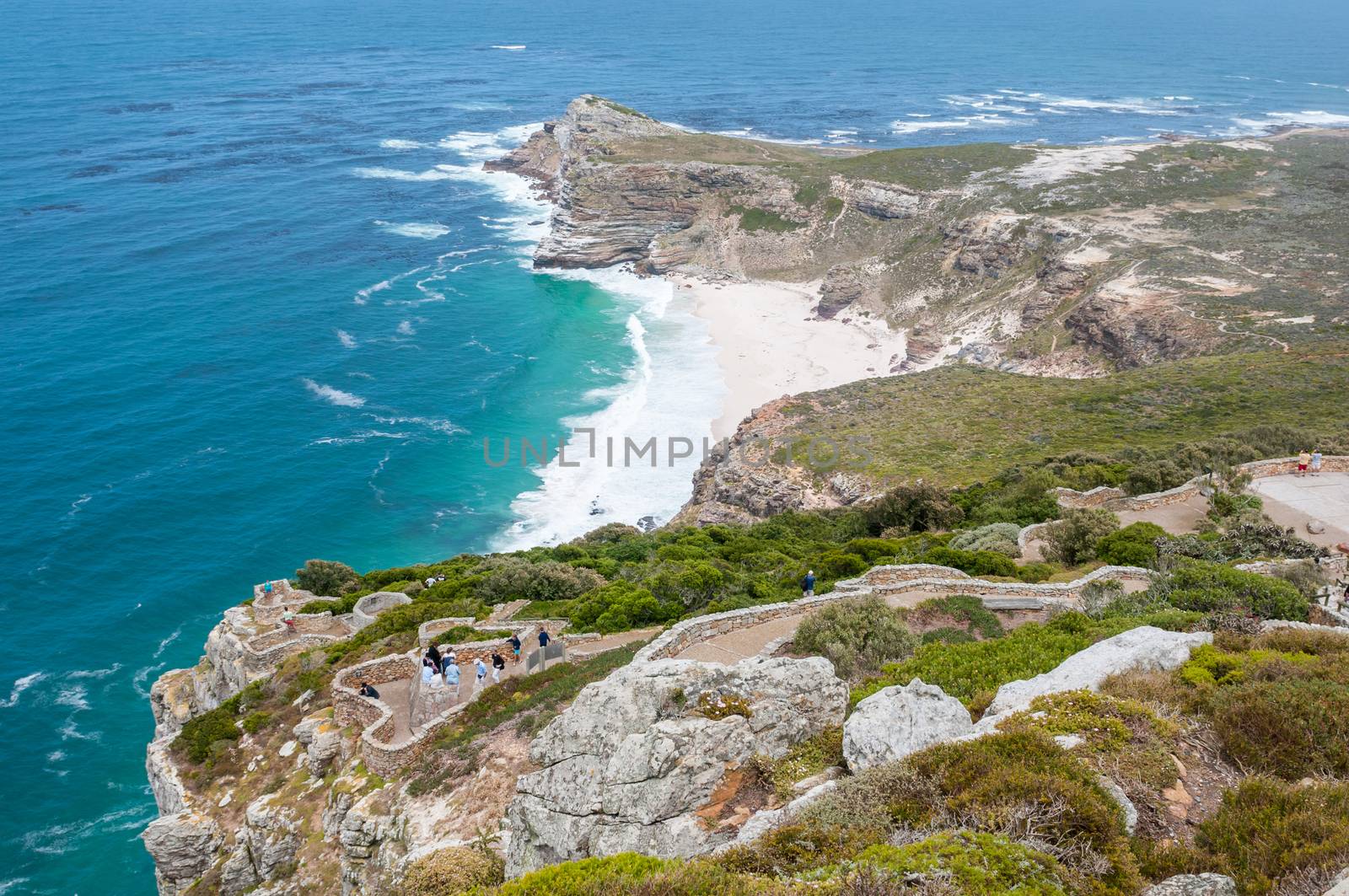 CAPE TOWN, SOUTH AFRICA - DECEMBER 12, 2014:  Unidentified tourists enjoying the view towards Dias Beach and the Cape of Good Hope to the west of Cape Point
