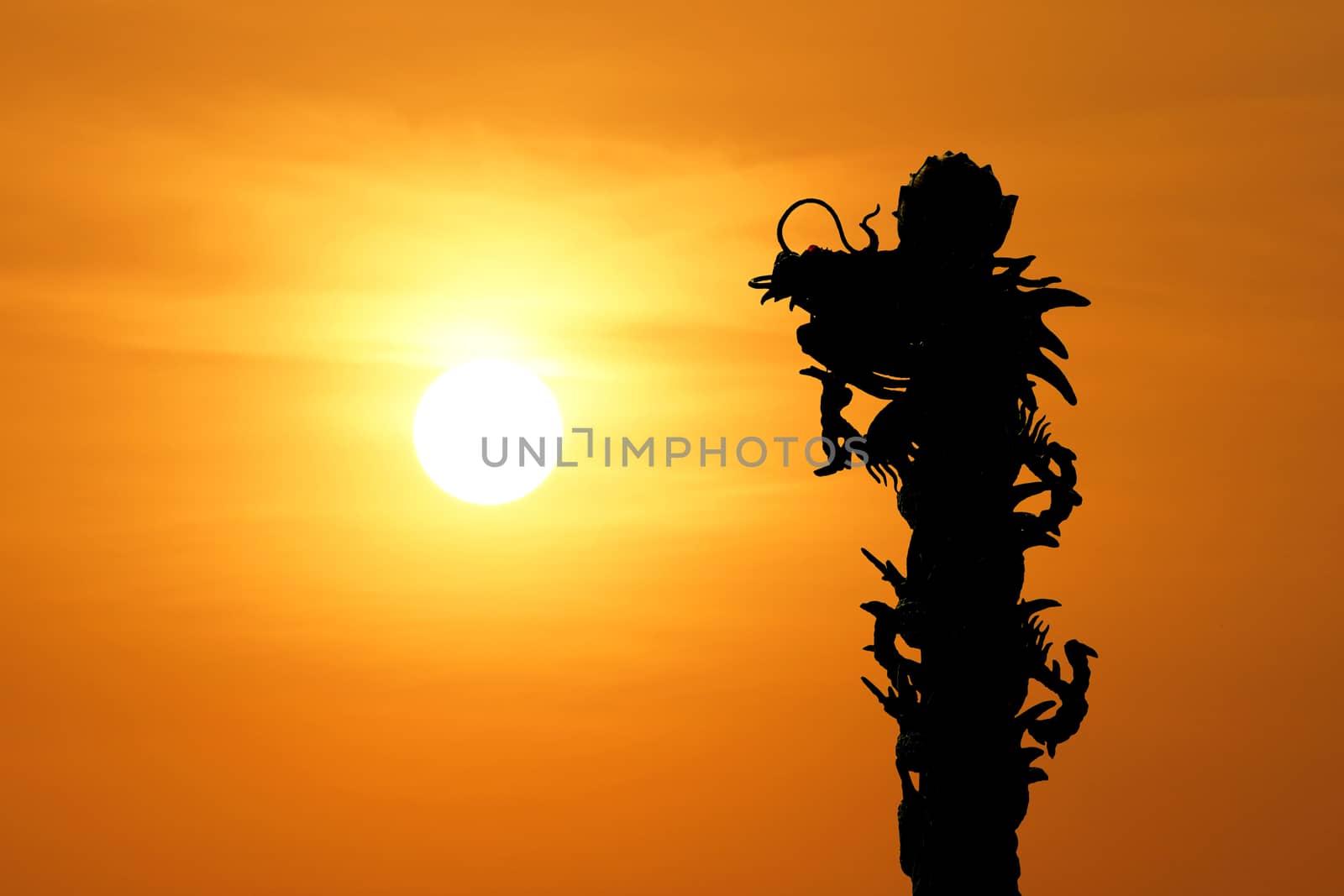  silhouette of  chinese dragon with beautiful sunset background          